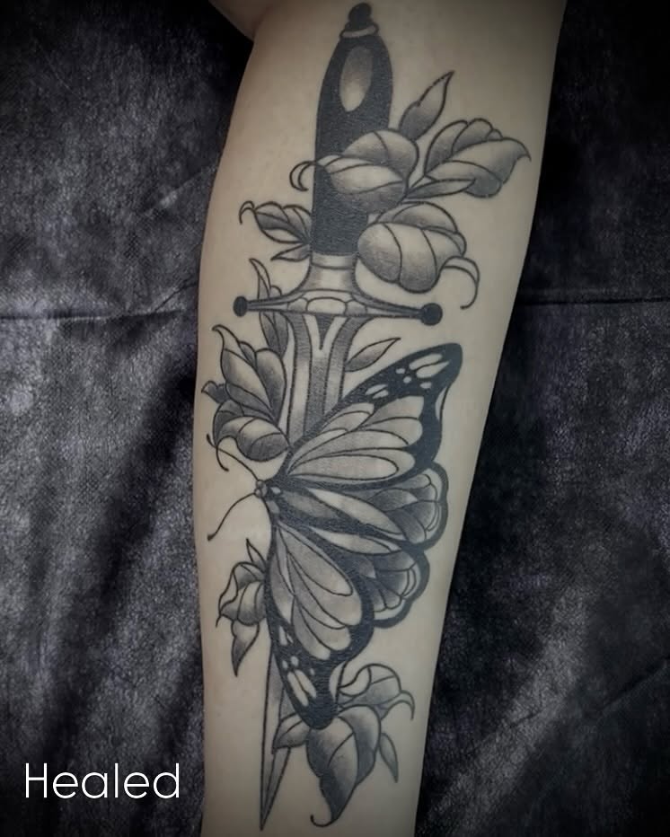 Knife and butterfly black and grey tattoo on the forearm by Shelbie, Salt Lake City, Utah