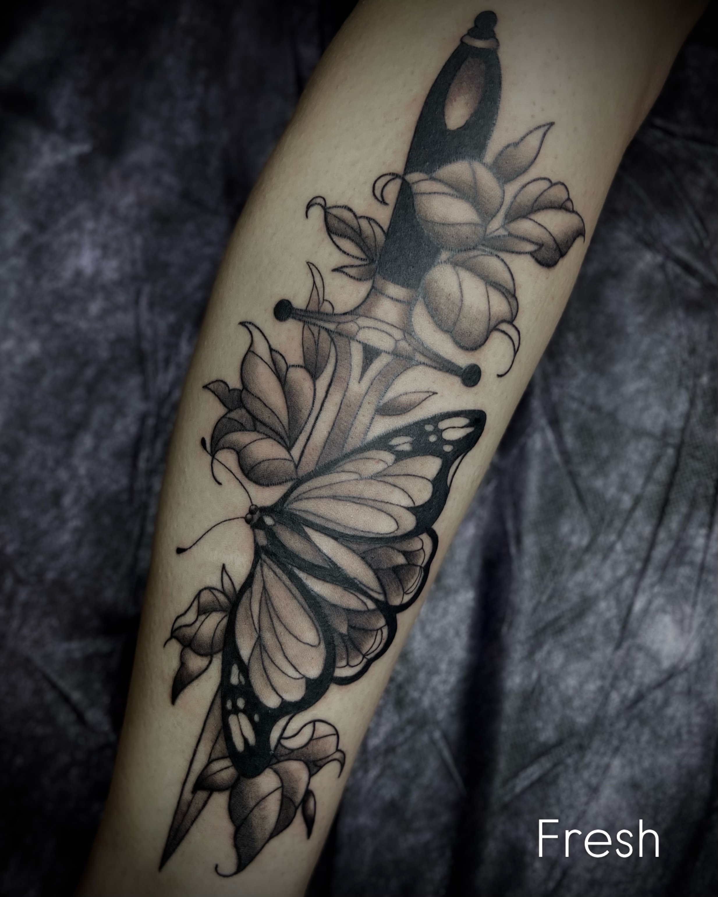 Butterfly and flowers realism tattoo on the forearm by Shelbie, Salt Lake City, Utah