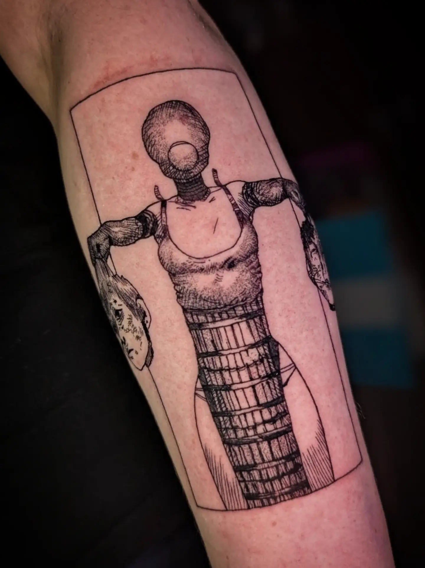 Robot black and grey tattoo on the forearm by Seth Chitwood