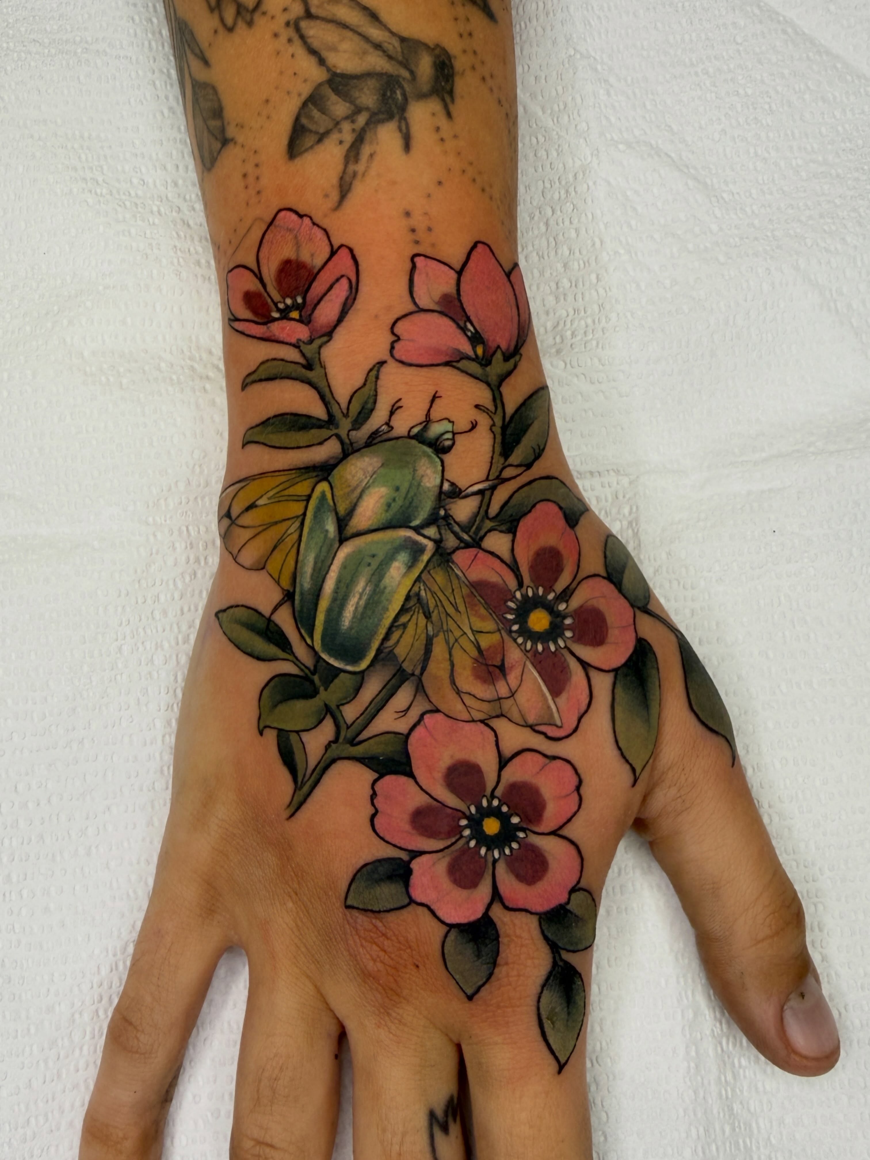 Floral bouquet dotwork tattoo on the hand by Samantha Compasso Ford