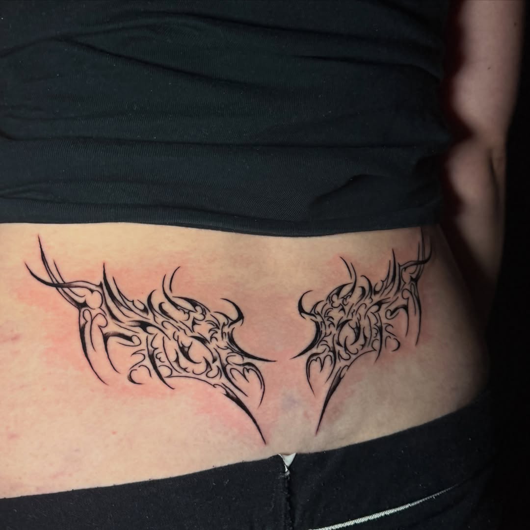 Tribal wings tribal tattoo on the ribs by tattoo artist (mollz)