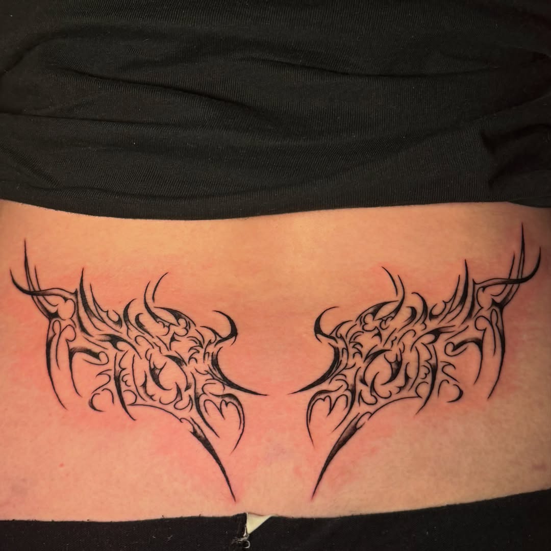 Tribal wings tribal tattoo on the torso by tattoo artist (mollz)