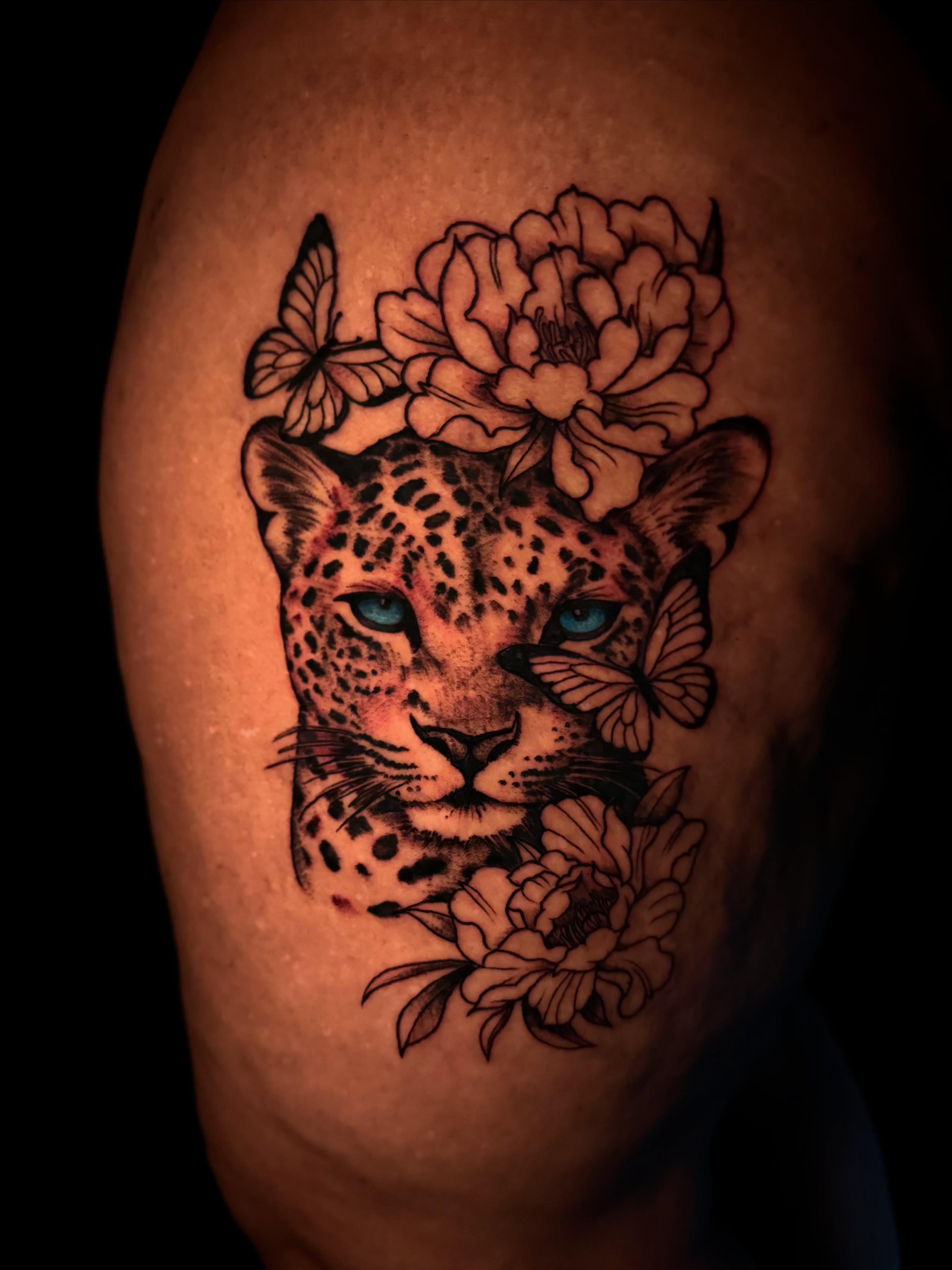 Leopard with flowers realism tattoo on the shoulder by π΅ππππππ¦π€
