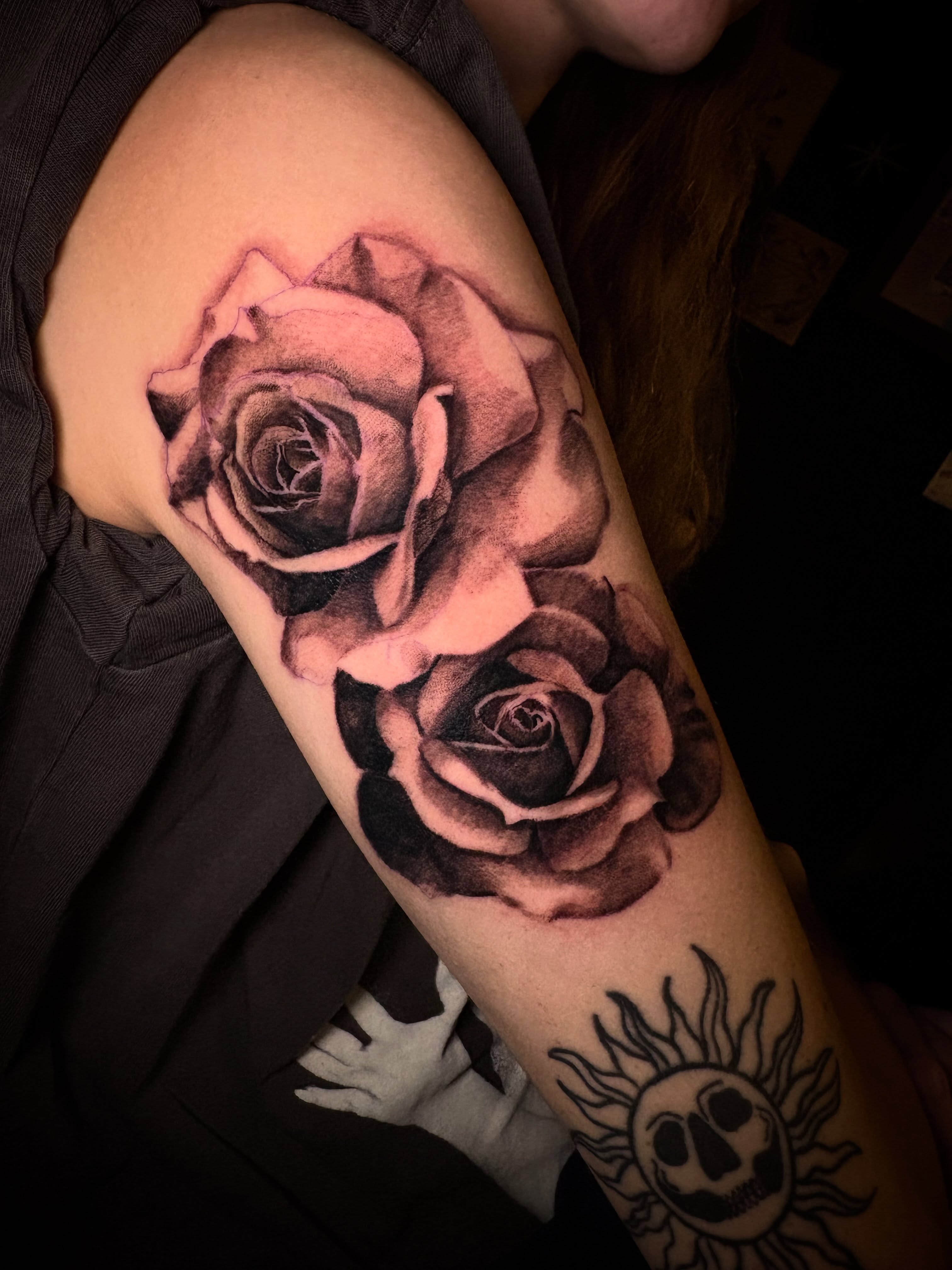 Roses realism tattoo on the forearm by Haley Byers