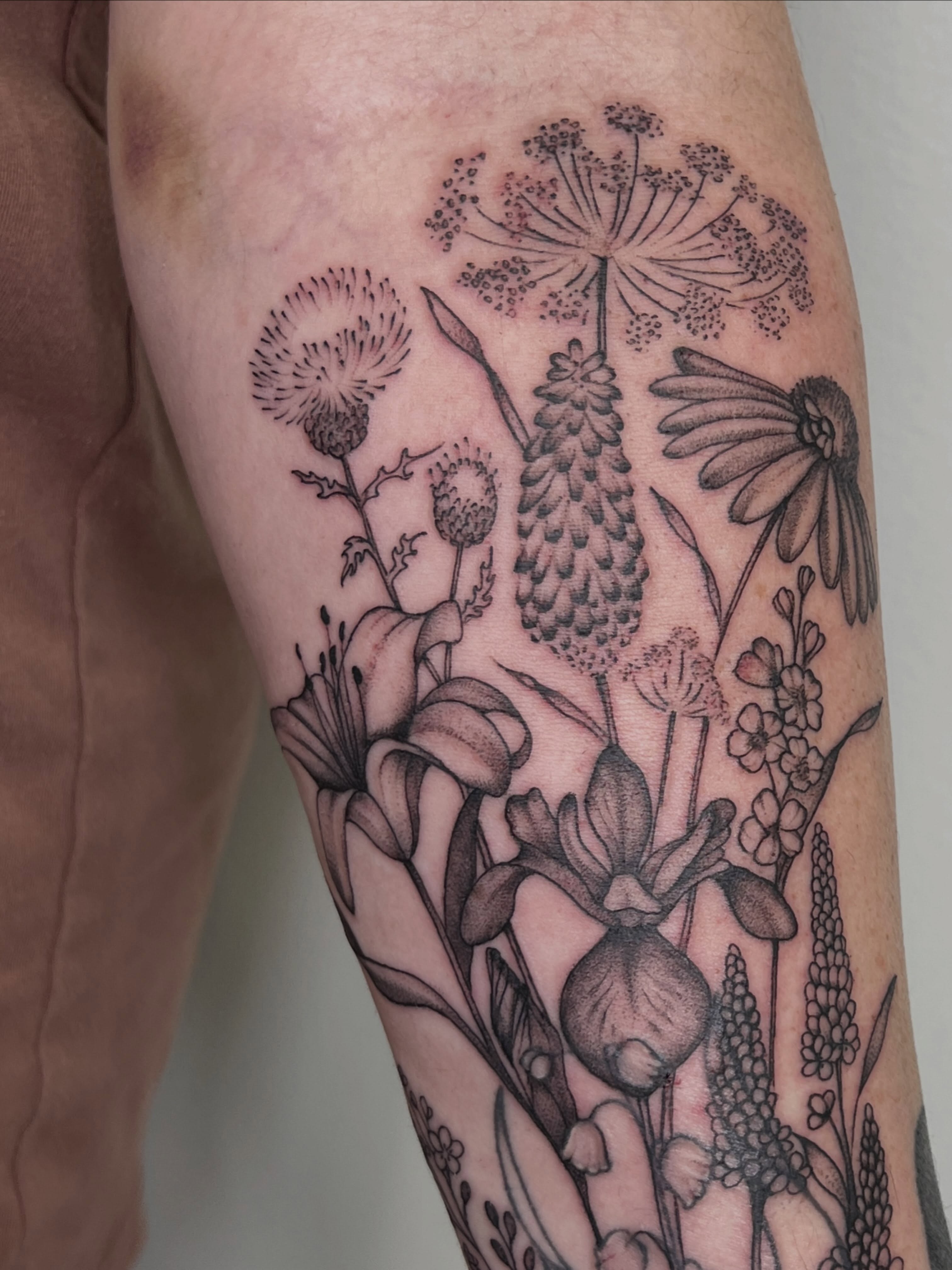 Wildflowers black and grey tattoo on the forearm by Presley Tattoos, Murfreesboro, Tennessee