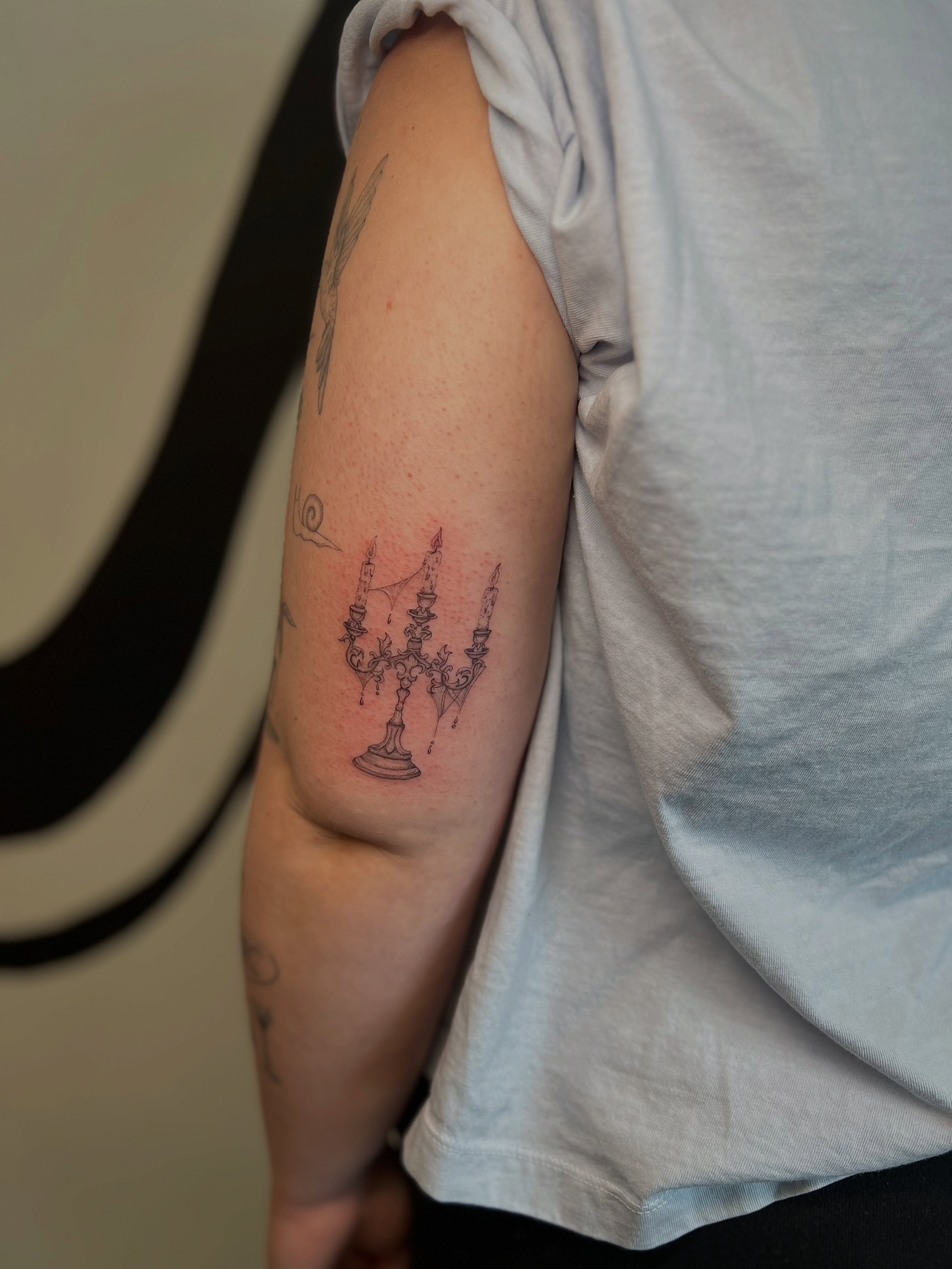 Candelabra black and grey tattoo on the forearm by ✿ 𝐉𝐮𝐝𝐢 ✿ 𝐒𝐋𝐂, 𝐔𝐓 𝐅𝐢𝐧𝐞 𝐋𝐢𝐧𝐞 𝐓𝐚𝐭𝐭𝐨𝐨𝐬
