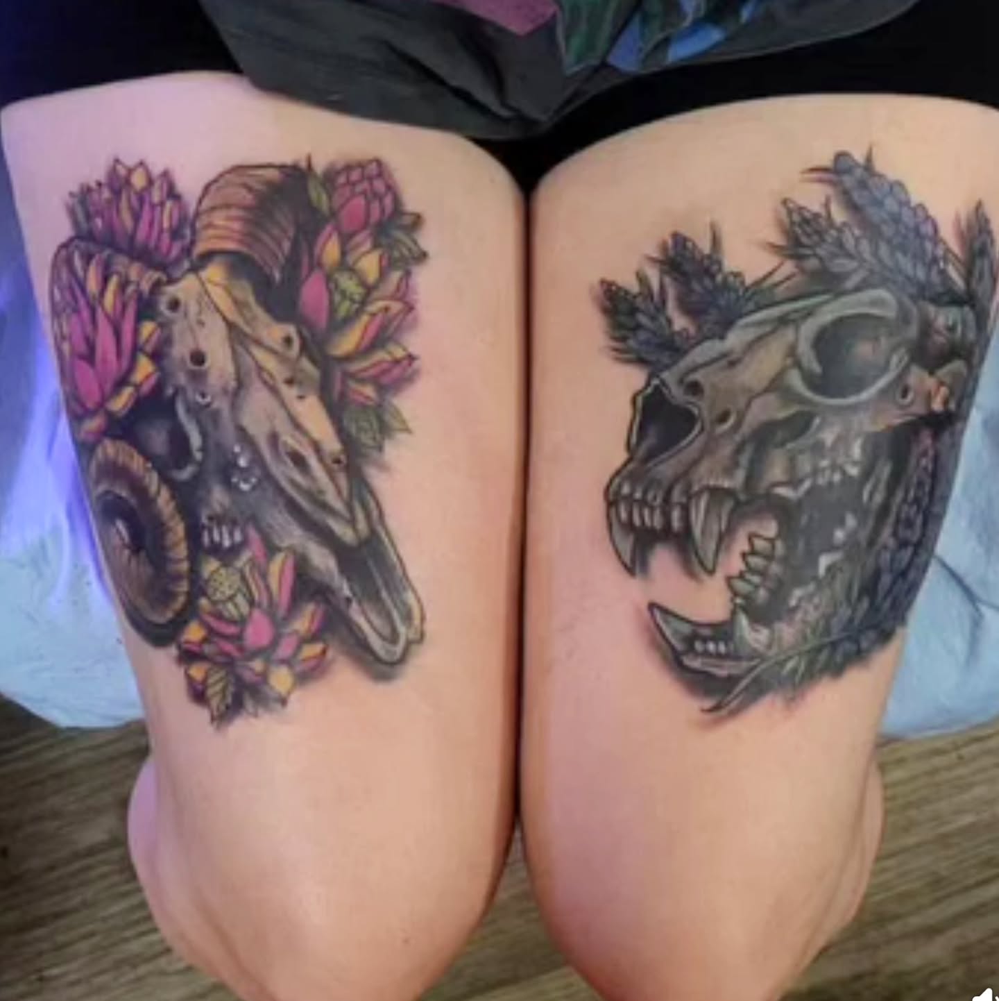 Skull and flowers realism tattoo on the thigh by Shane Watkins