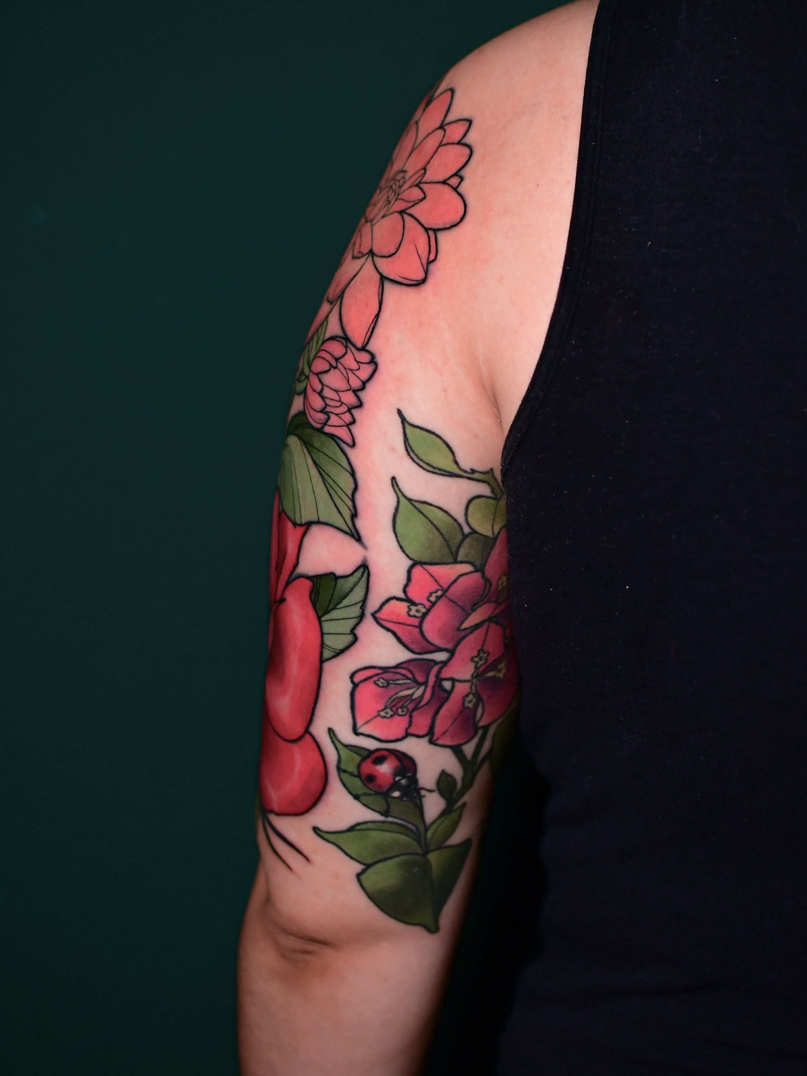 Floral bouquet new school tattoo on the upper arm by Karina πΌ Orange County Tattoo Artist