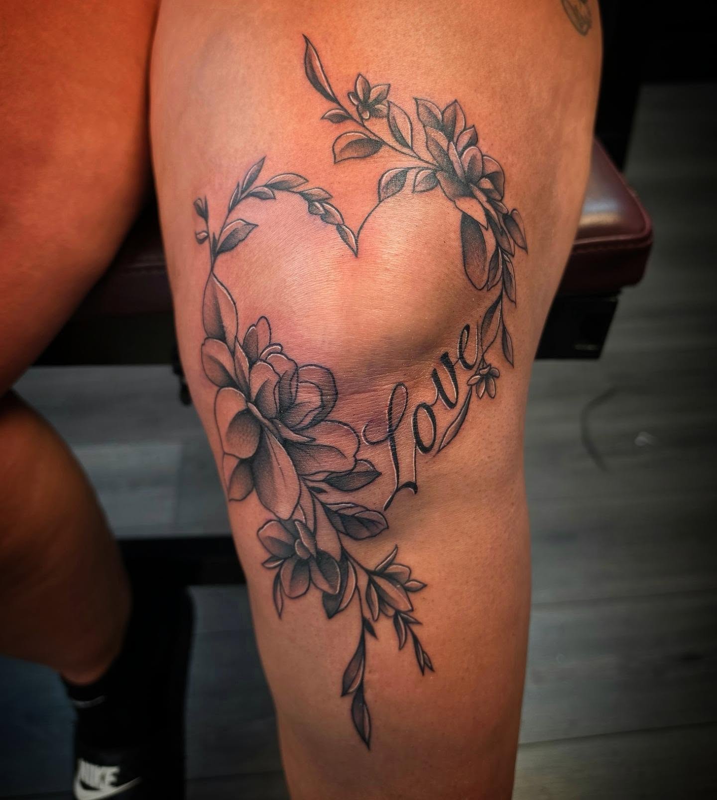 Flower heart black and grey tattoo on the thigh by Danielle Elizabeth
