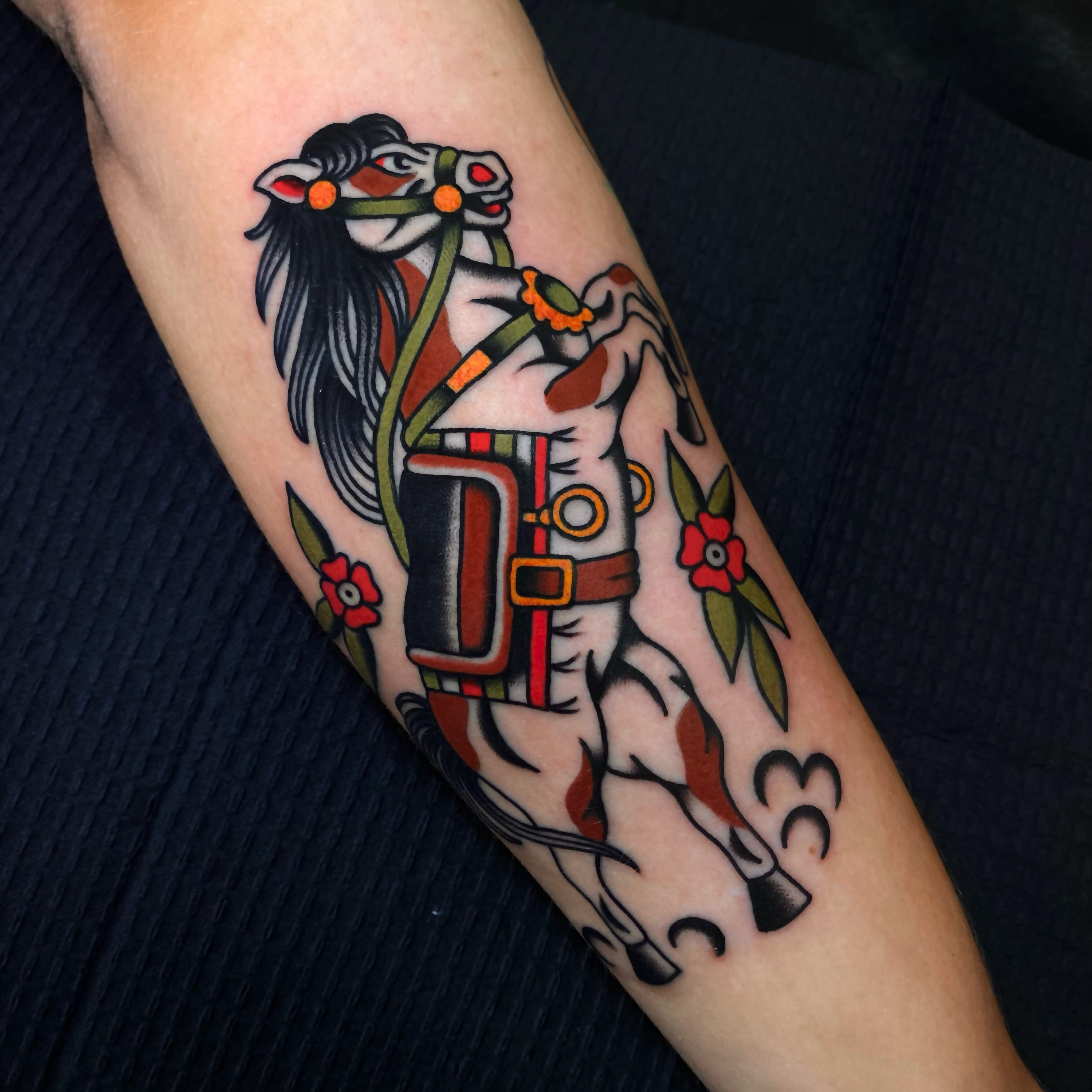 Horse and rider American traditional tattoo on the forearm by Justin R. Mitchell, Fort Worth, Texas