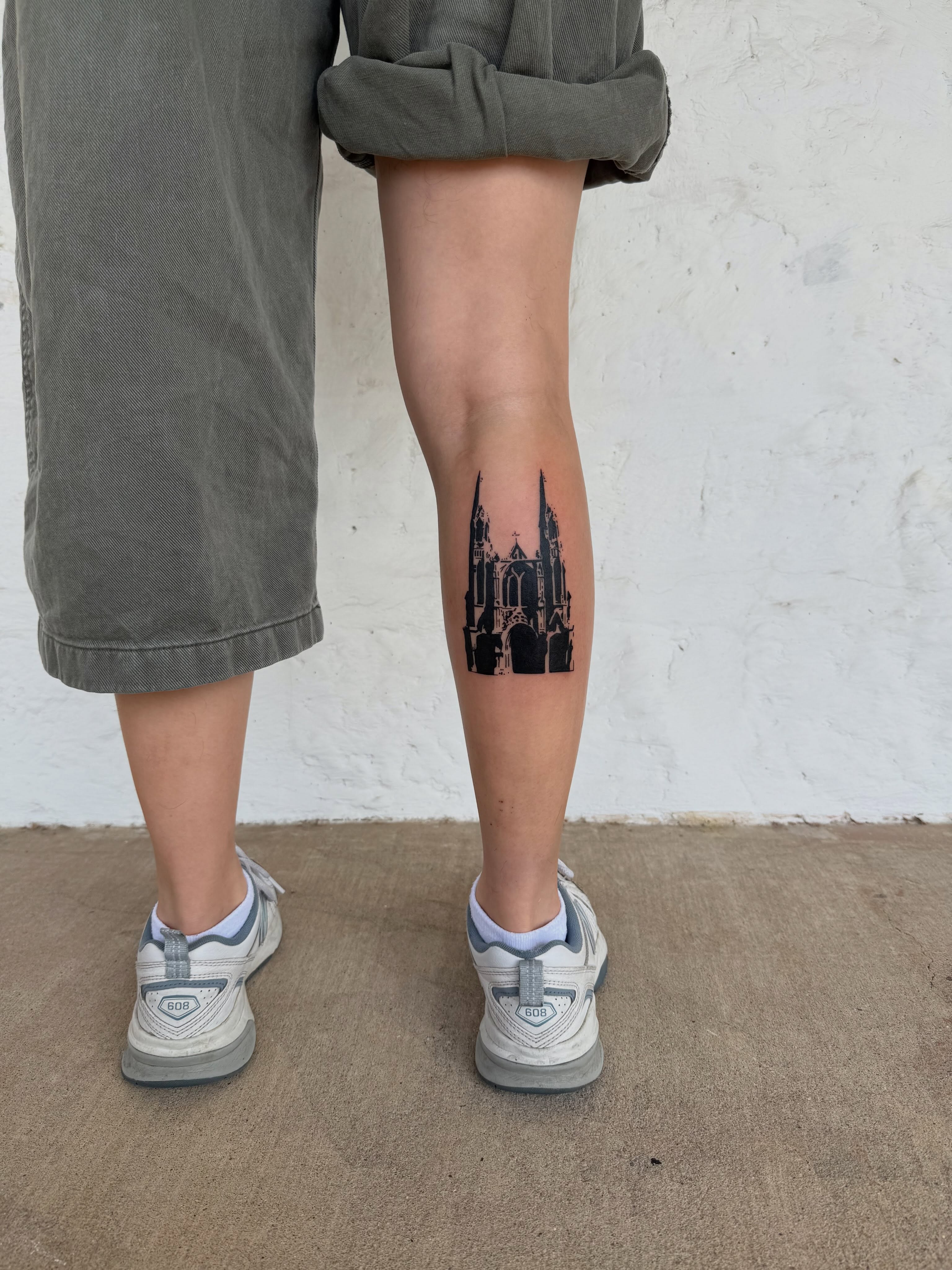 Gothic cathedral black and grey tattoo on the thigh by sarah