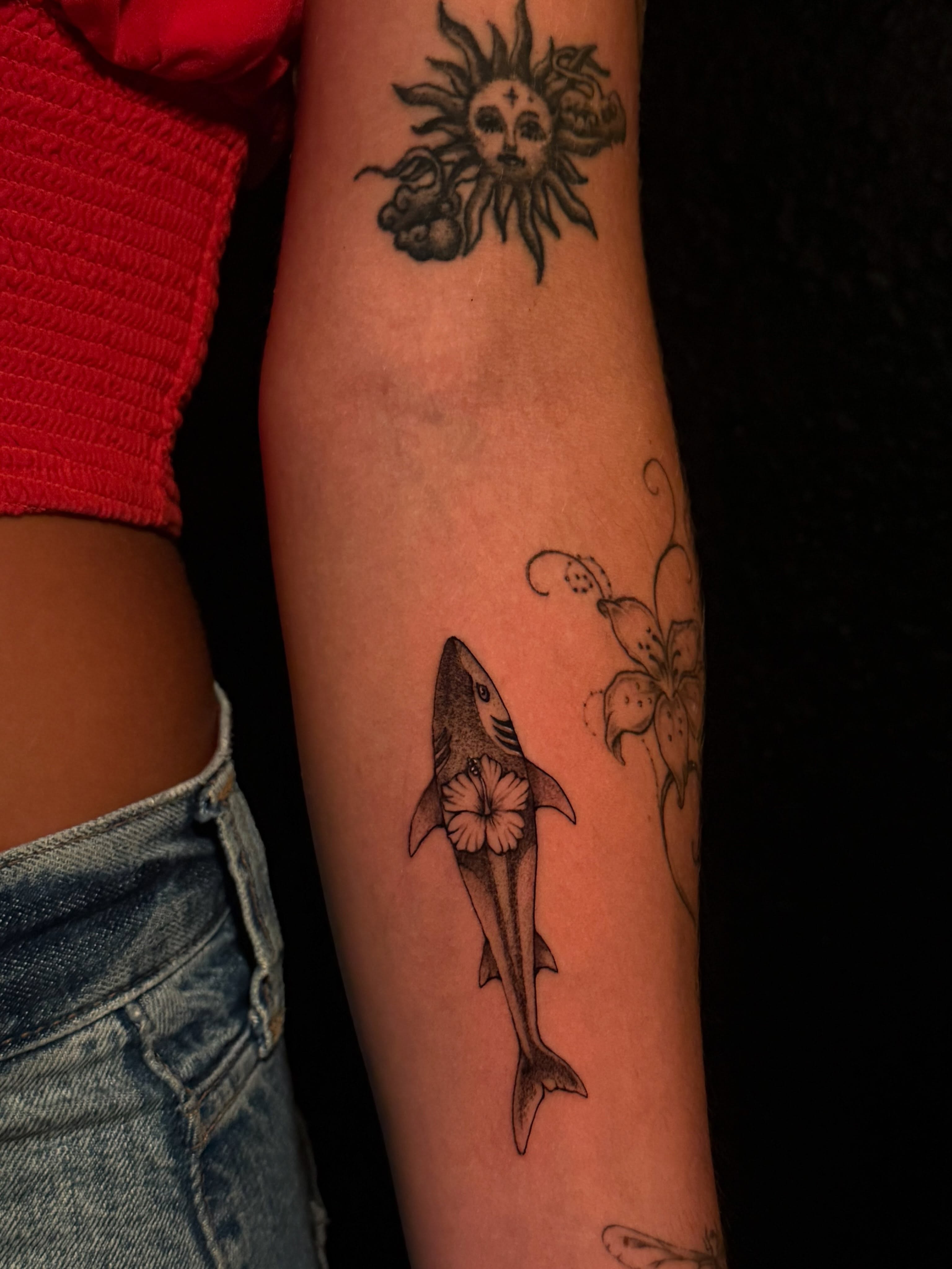 Shark with flower black and grey tattoo on the forearm by Elijah Tattoos, San Diego, California