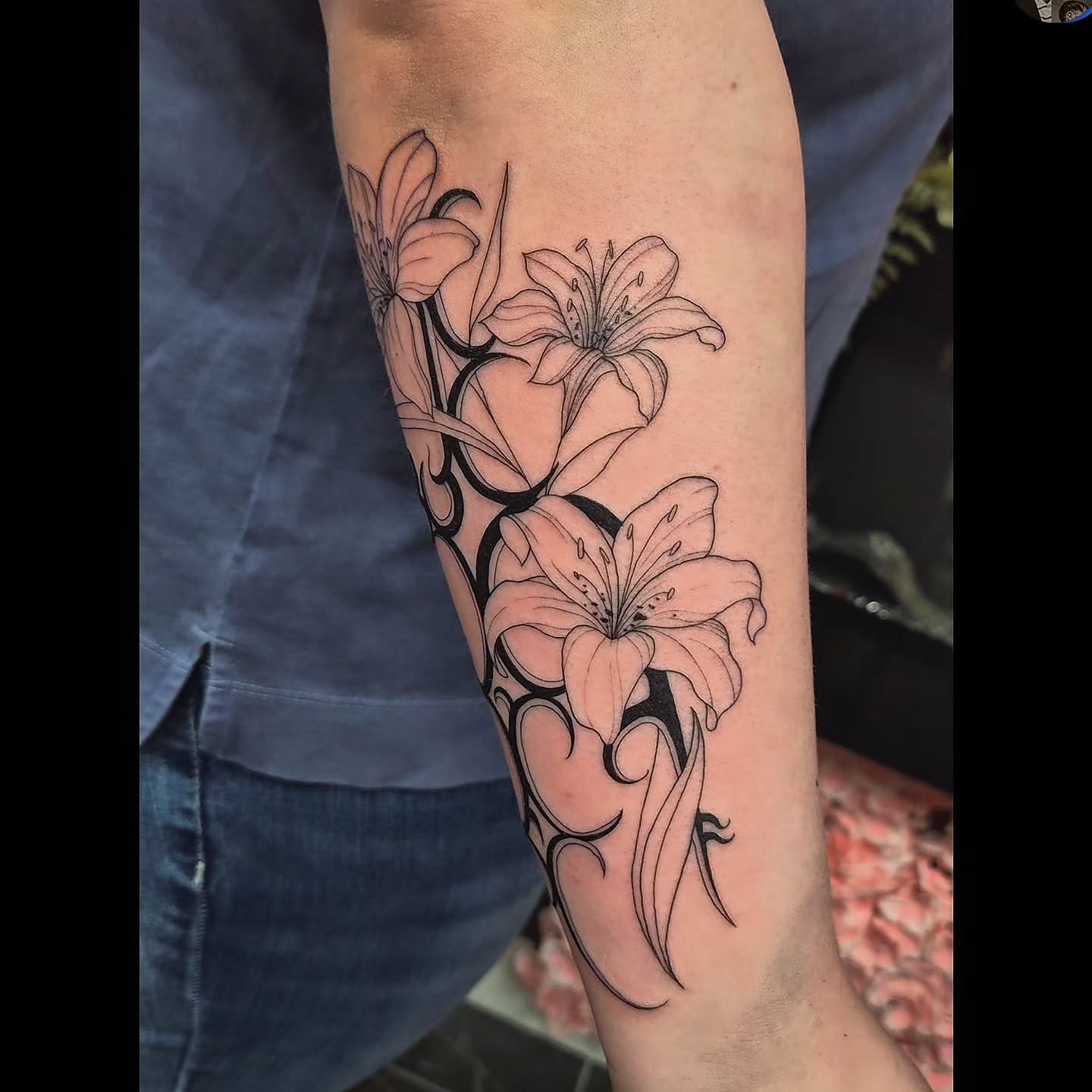 Lilies black and grey tattoo on the forearm by π±π½πππΎπ