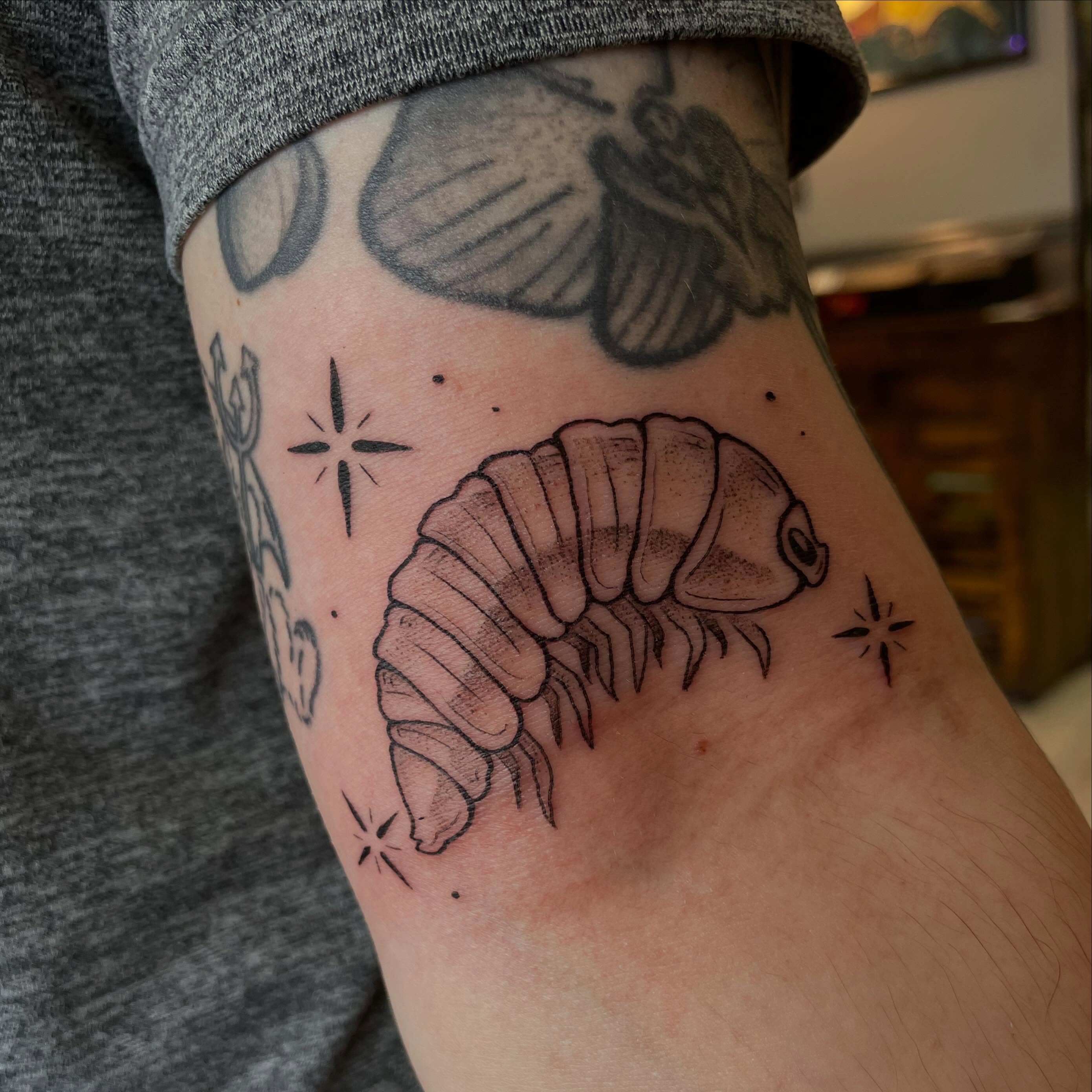 Croissant black and grey tattoo on the forearm by Stevie Timmreck, Utica, Michigan