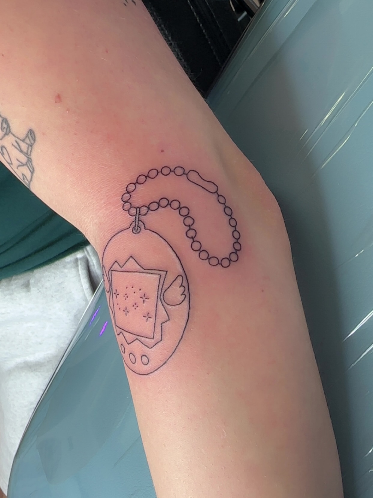 Rosary minimalist tattoo on the forearm by NuNu