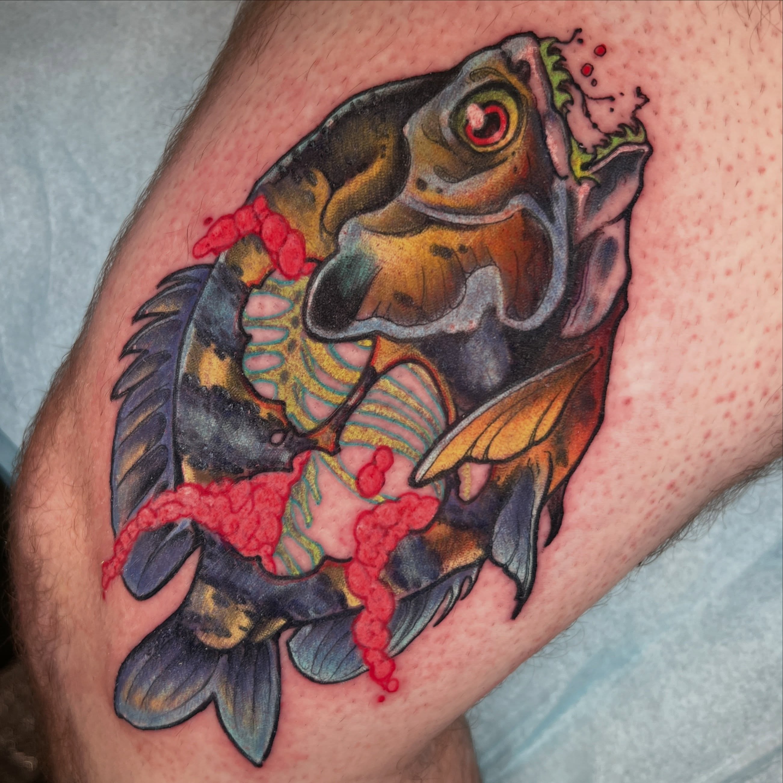 Fish realism tattoo on the thigh by Kate Erso