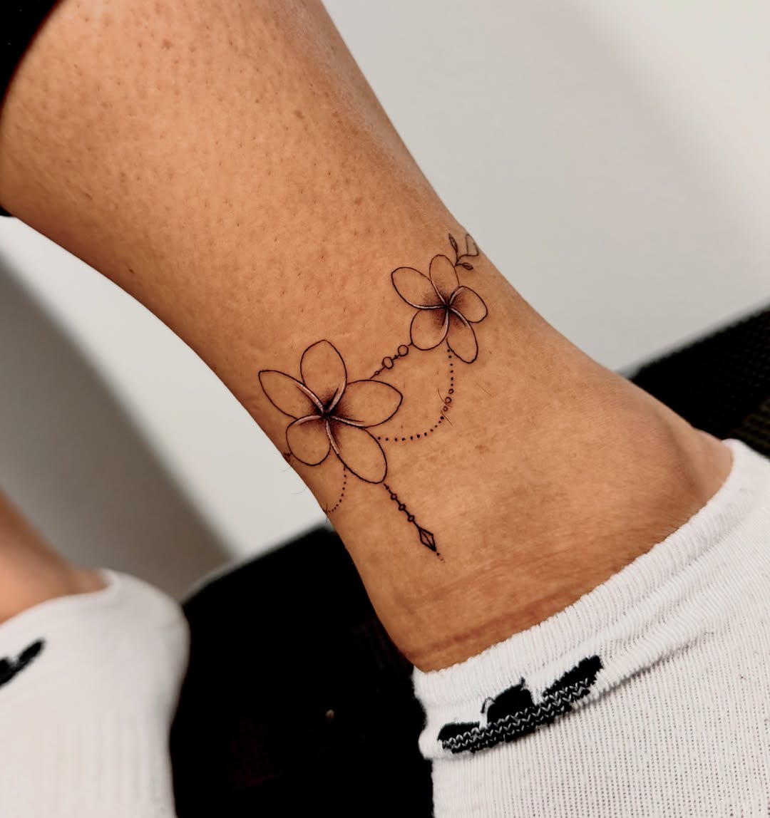 Plumeria flowers dotwork tattoo by Orca