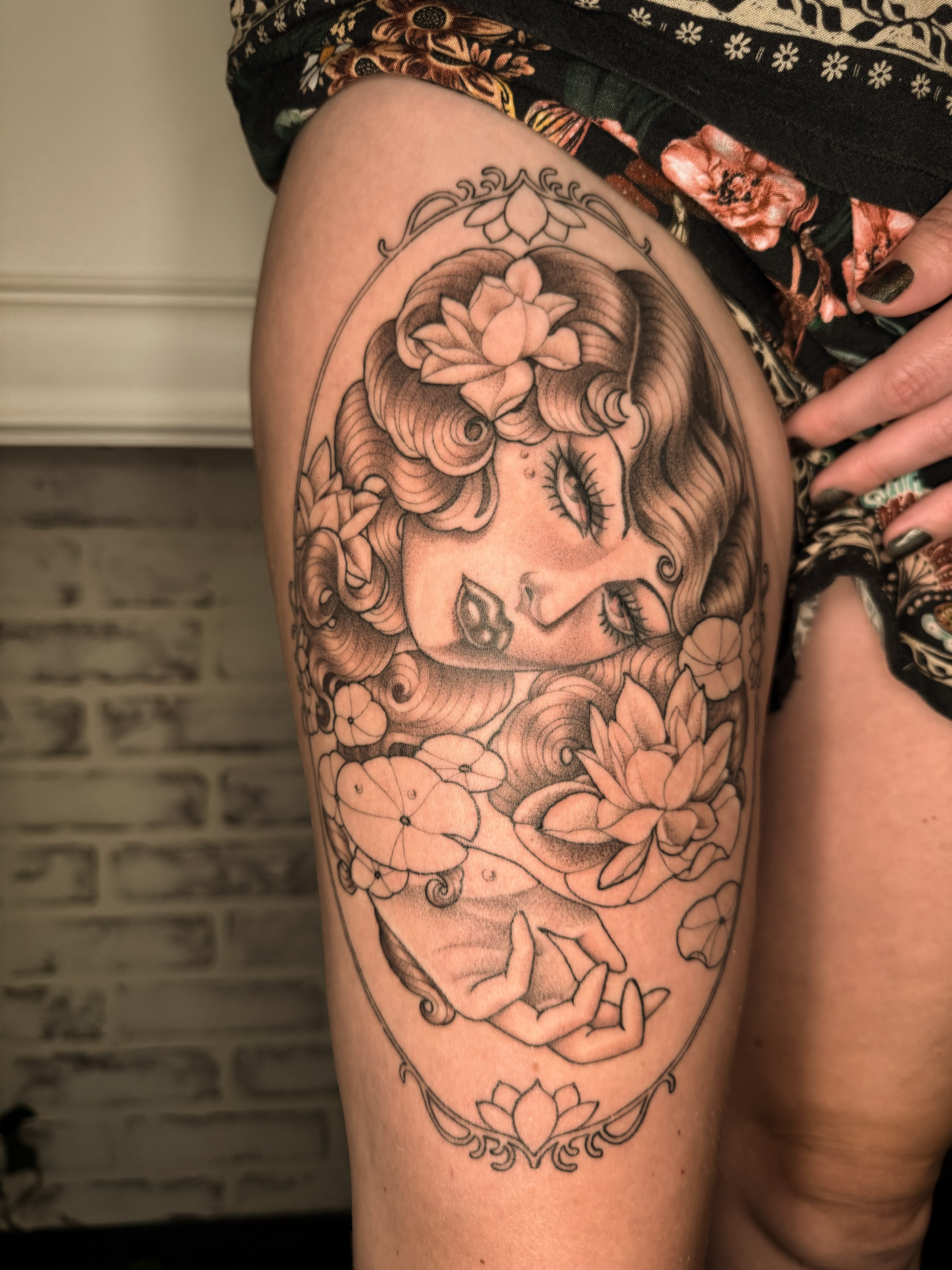 Woman with flowers illustrative tattoo on the thigh by Virginia 🥀Neo Traditional