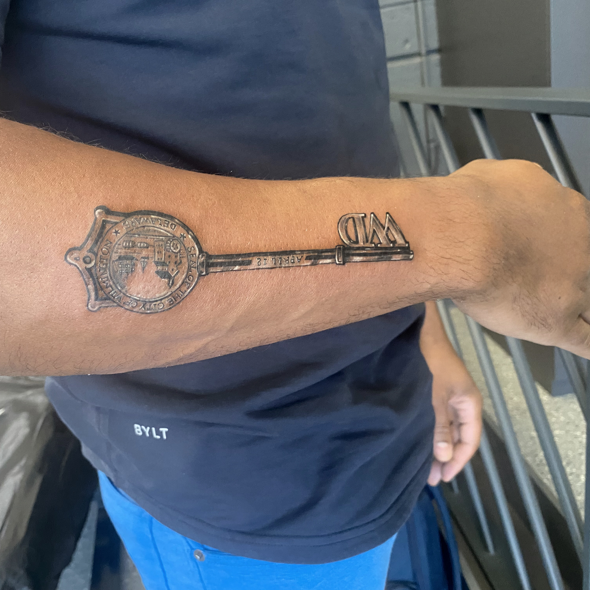 Key black and grey tattoo on the forearm by R o s e