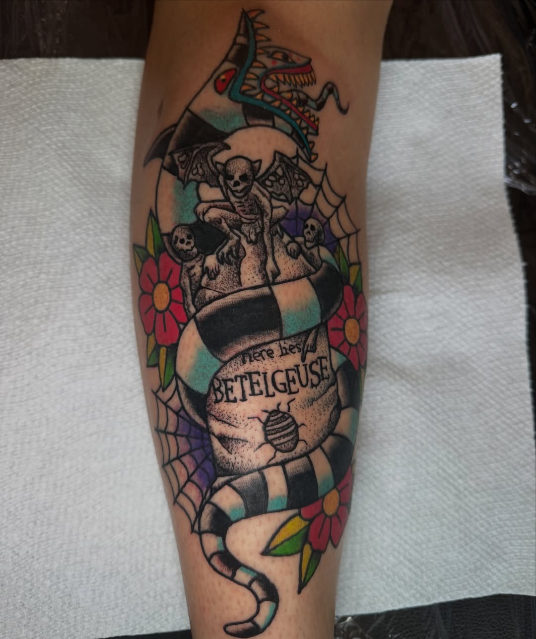 Skull and skeleton American traditional tattoo on the forearm by Oliver Ⴟ Graves