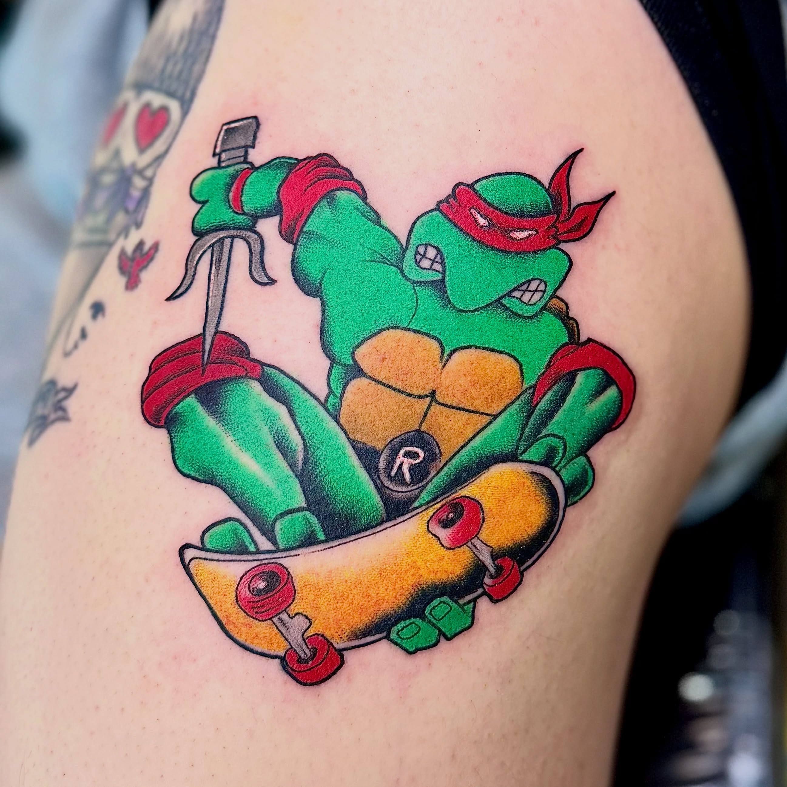 Skateboarding ninja turtle American traditional tattoo on the thigh by Jamie Hall, Kansas City, Missouri