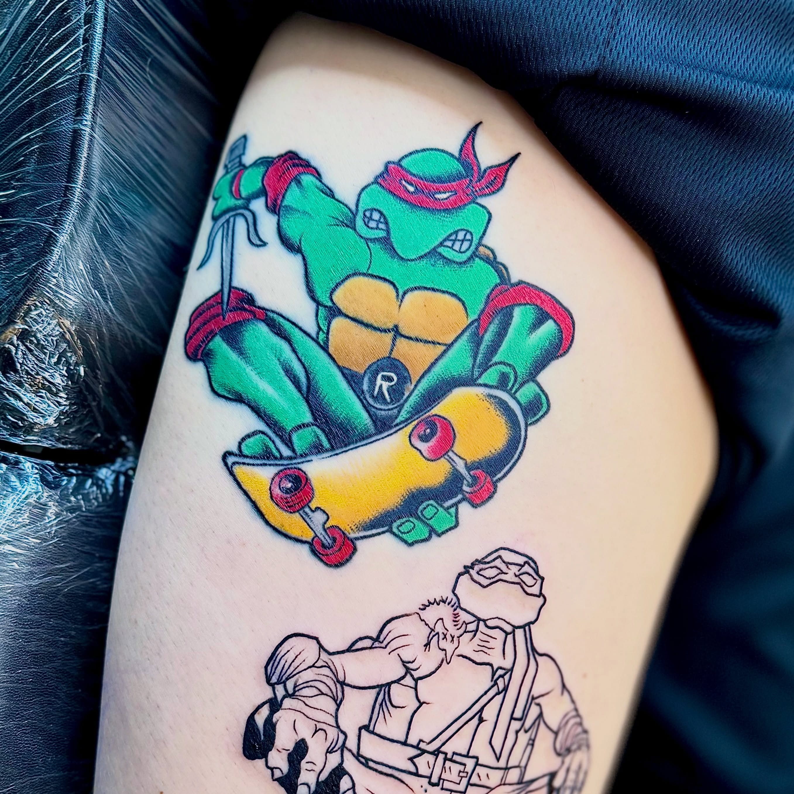 Teenage mutant ninja turtle on skateboard American traditional tattoo on the thigh by Jamie Hall, Kansas City, Missouri