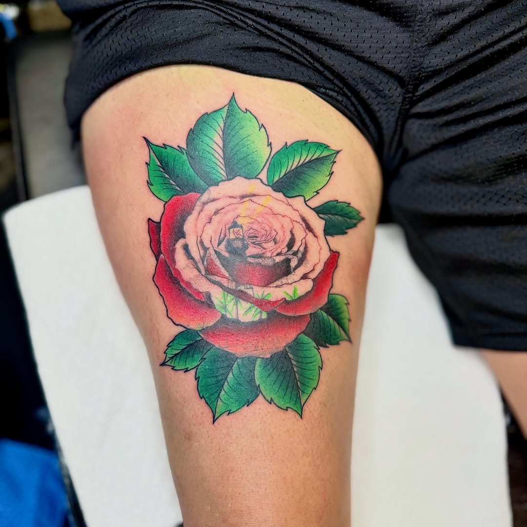 Rose American traditional tattoo on the thigh by Jamie Hall, Kansas City, Missouri