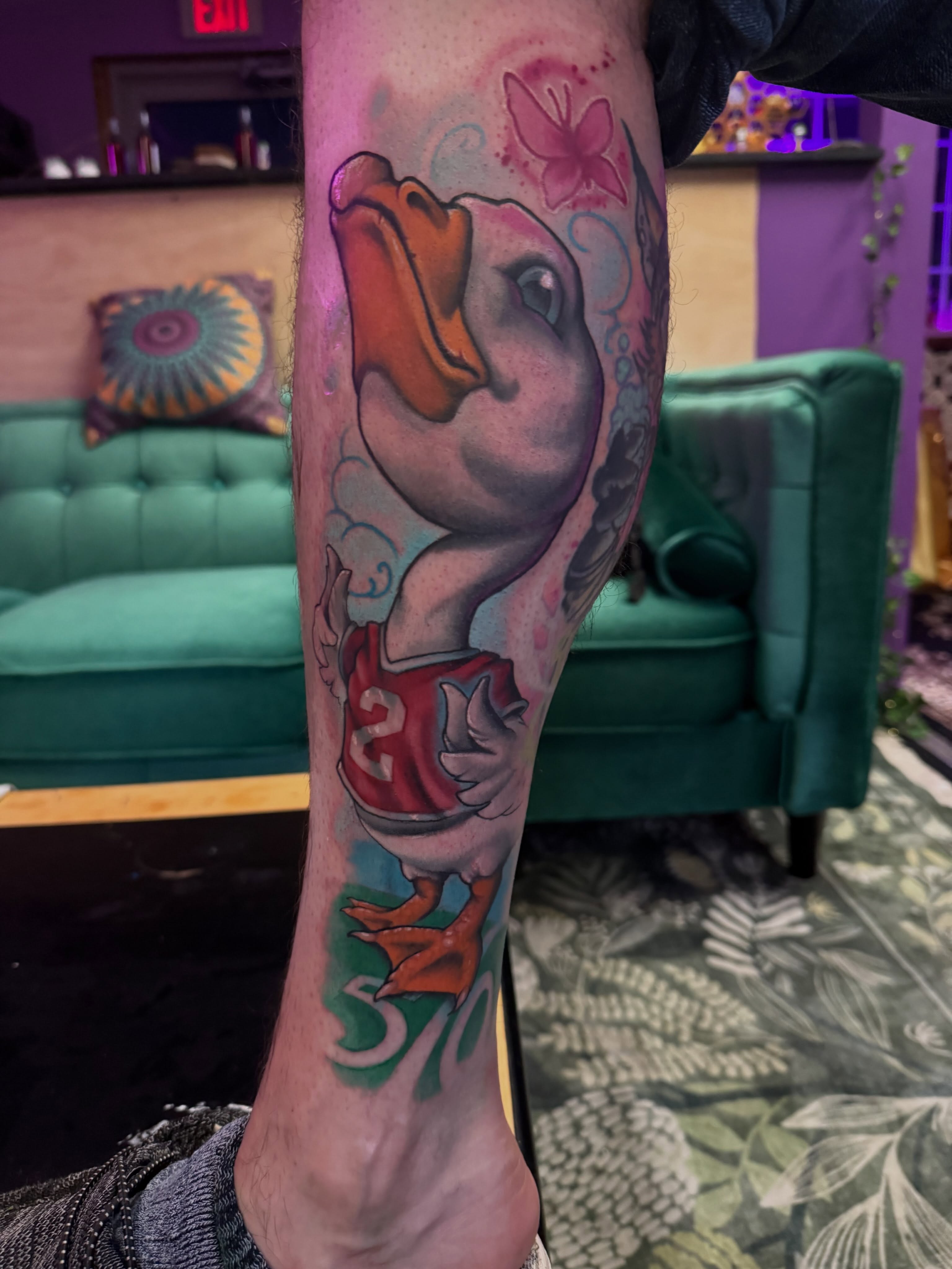 Goose wearing jersey realism tattoo on the forearm by Tatgunjoe, Salt Lake City, Utah