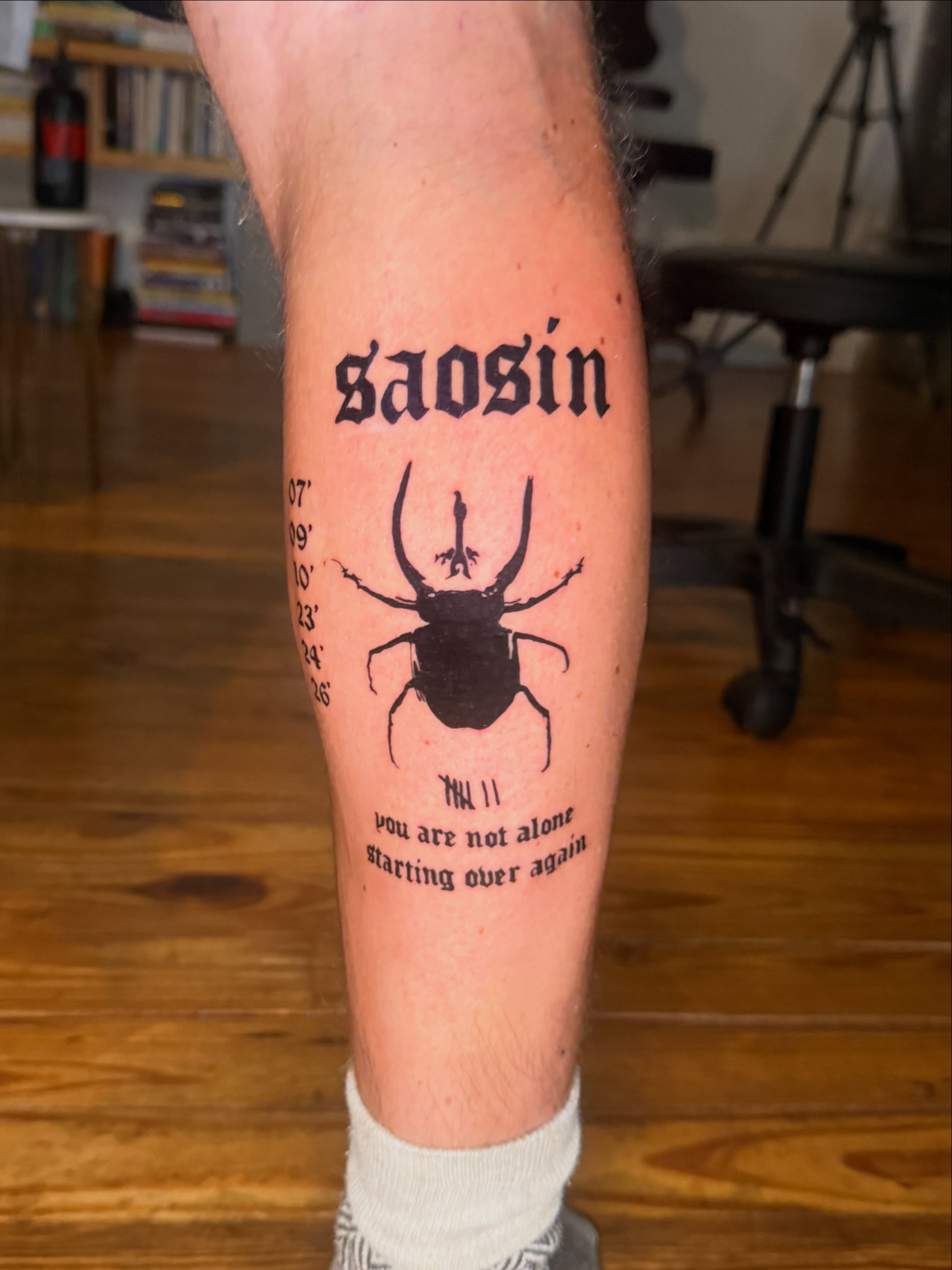 Stag beetle black and grey tattoo on the forearm by Jose Javier