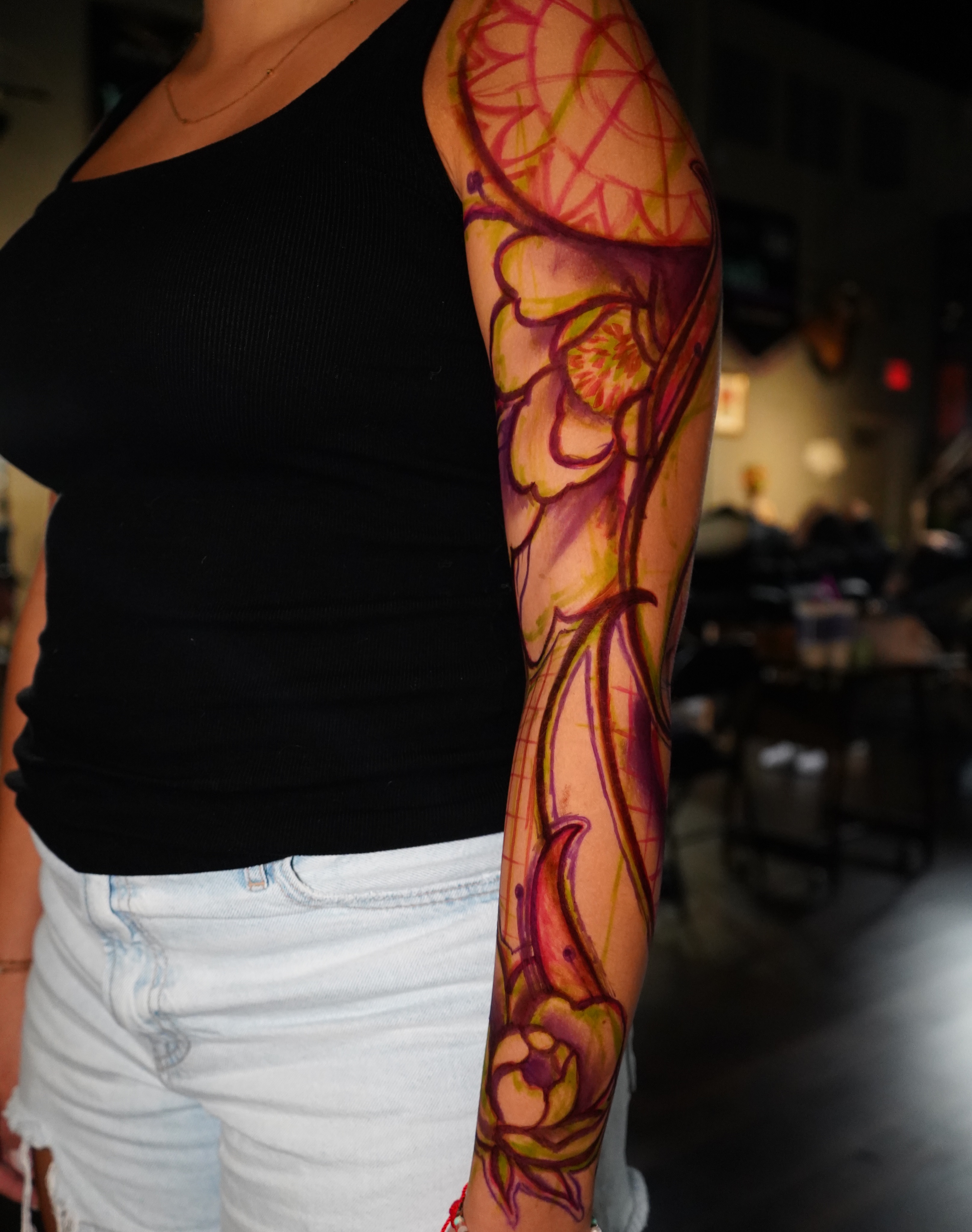 Floral design new school tattoo on the forearm by Haley Corinne