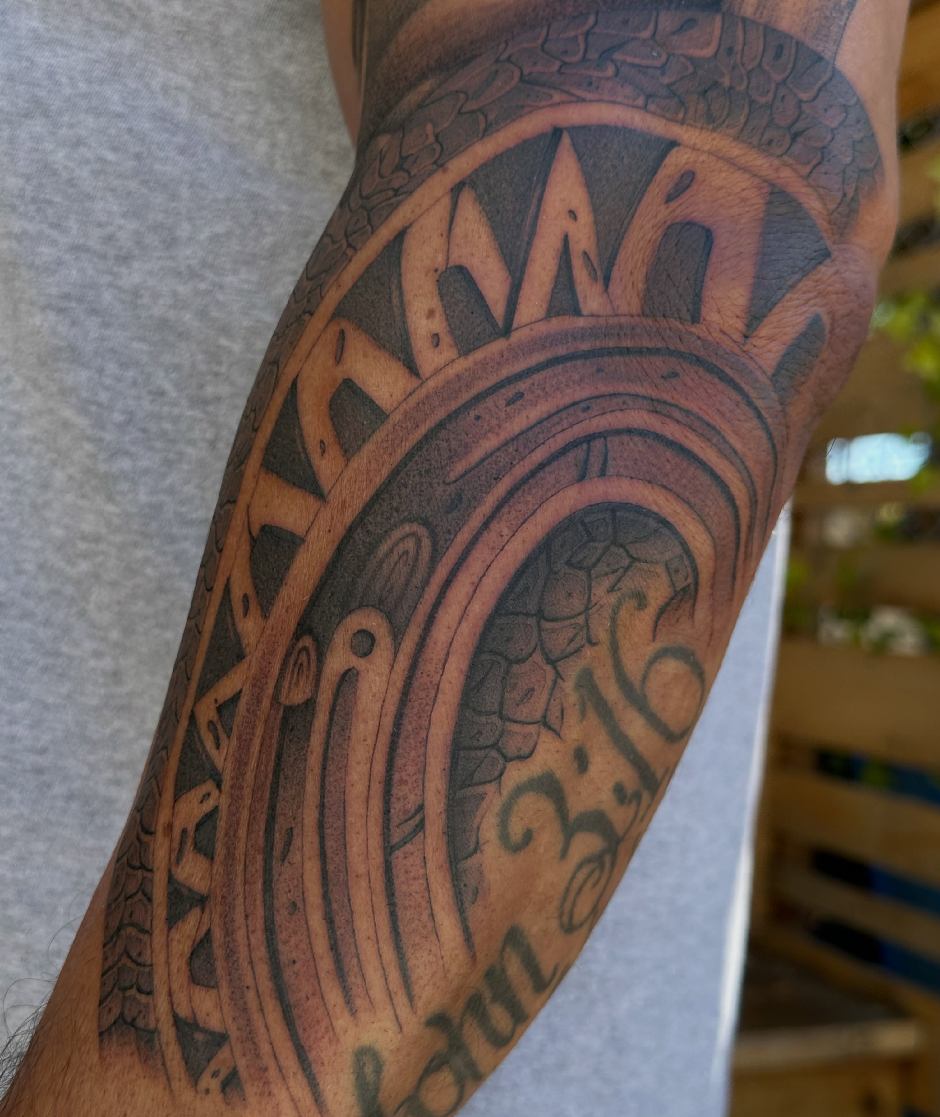 Religious symbol black and grey tattoo on the forearm by San Diego Tattoo Artist