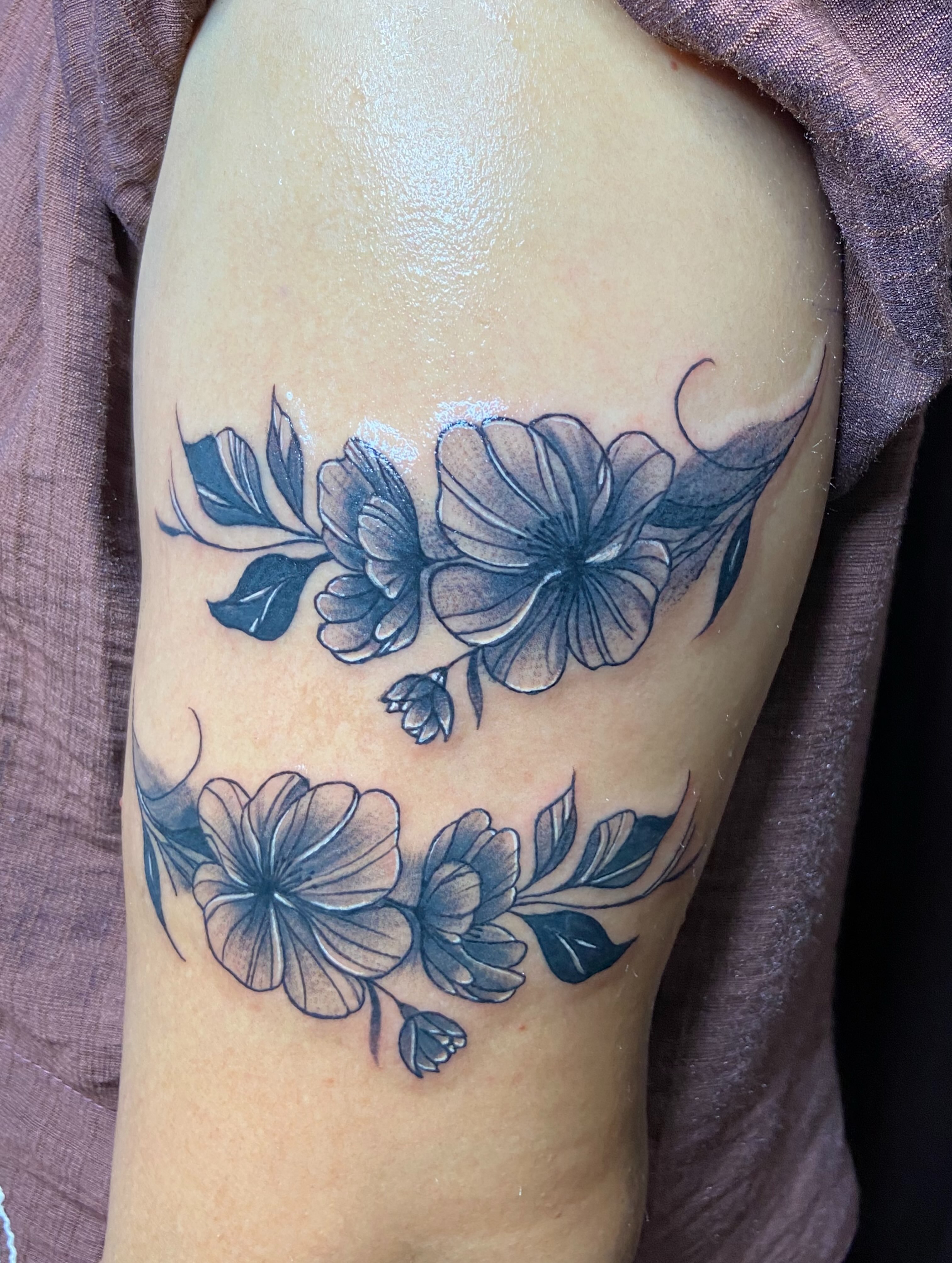 Floral arrangement black and grey tattoo on the shoulder by VR tattoo Studio