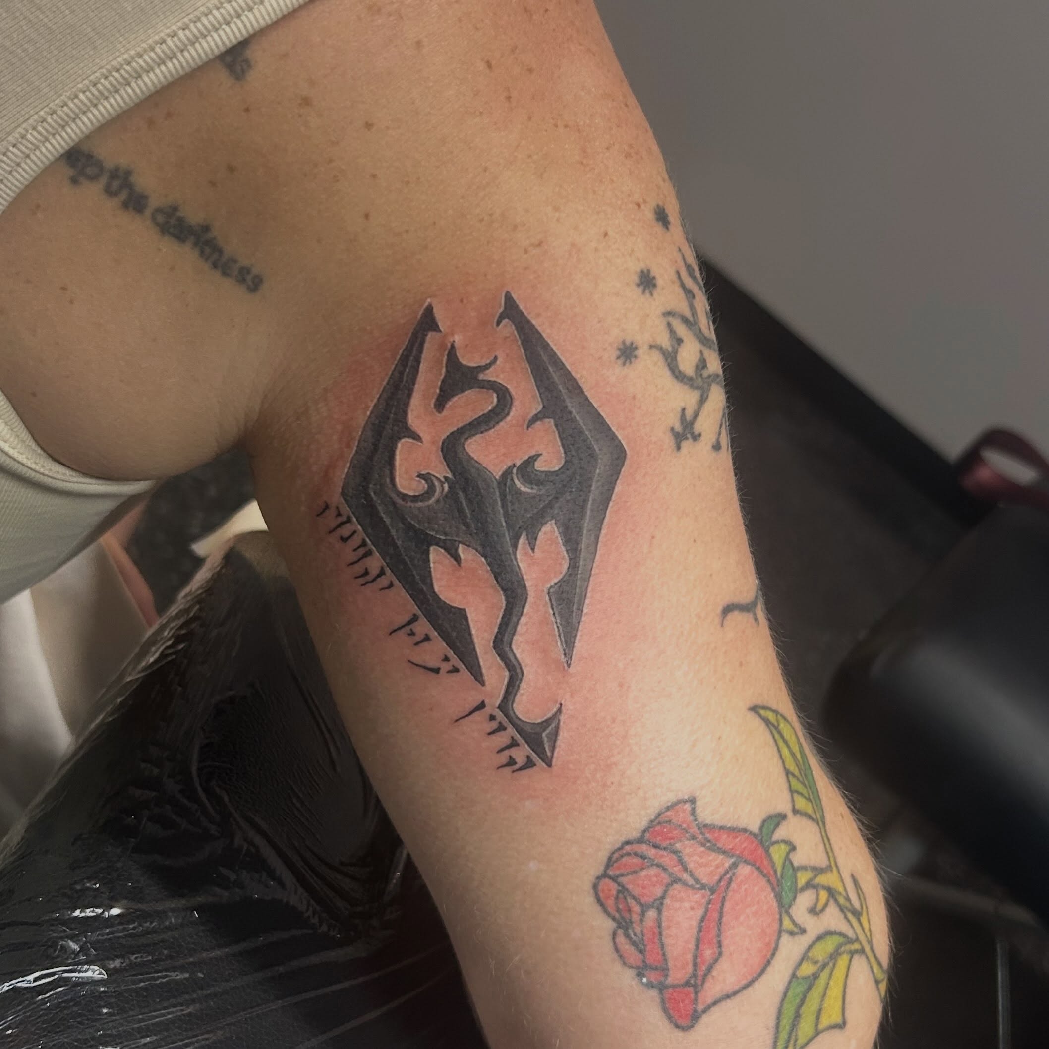 Dragon black and grey tattoo on the forearm by Jamie Winn