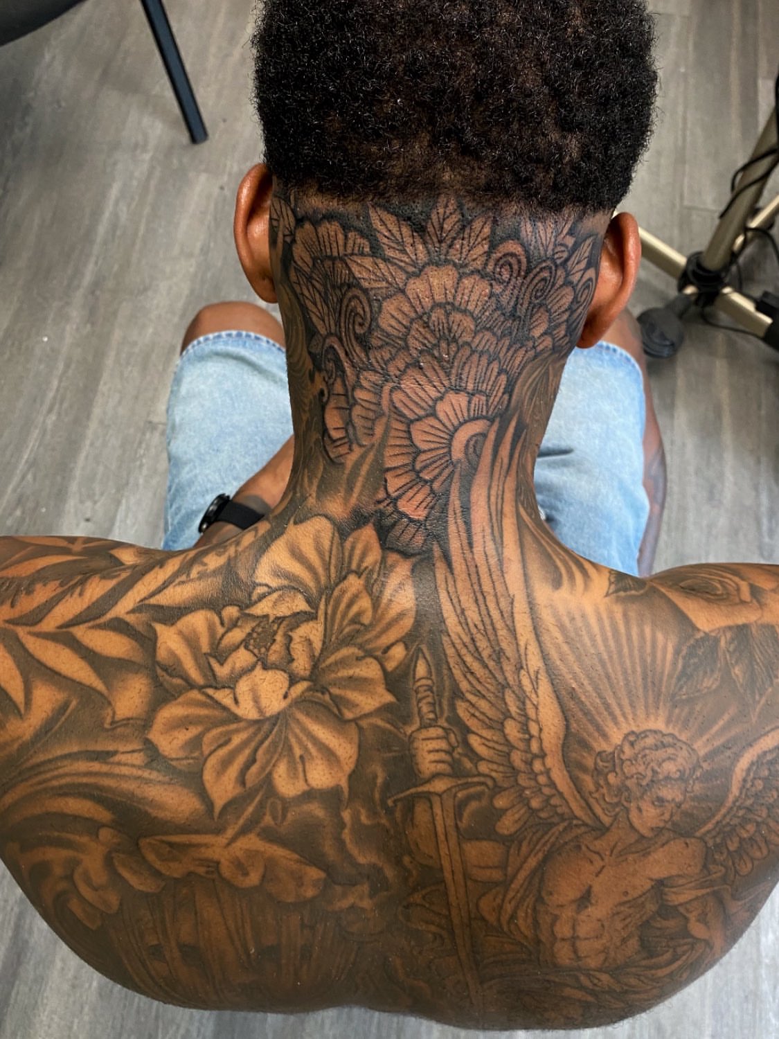 Floral angel realism tattoo on the back by Kelan Mckenna