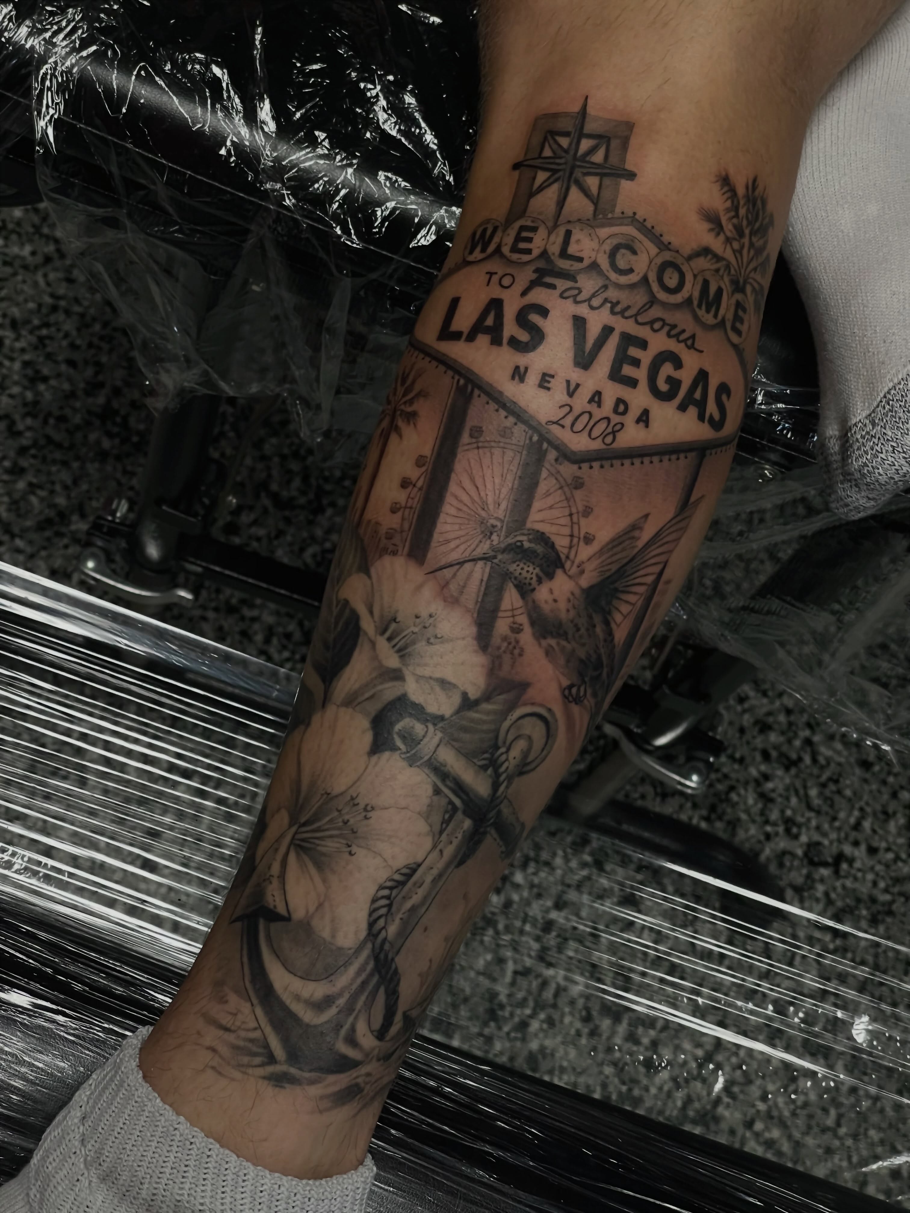 Las Vegas sign black and grey tattoo on the forearm by Jonathan Red