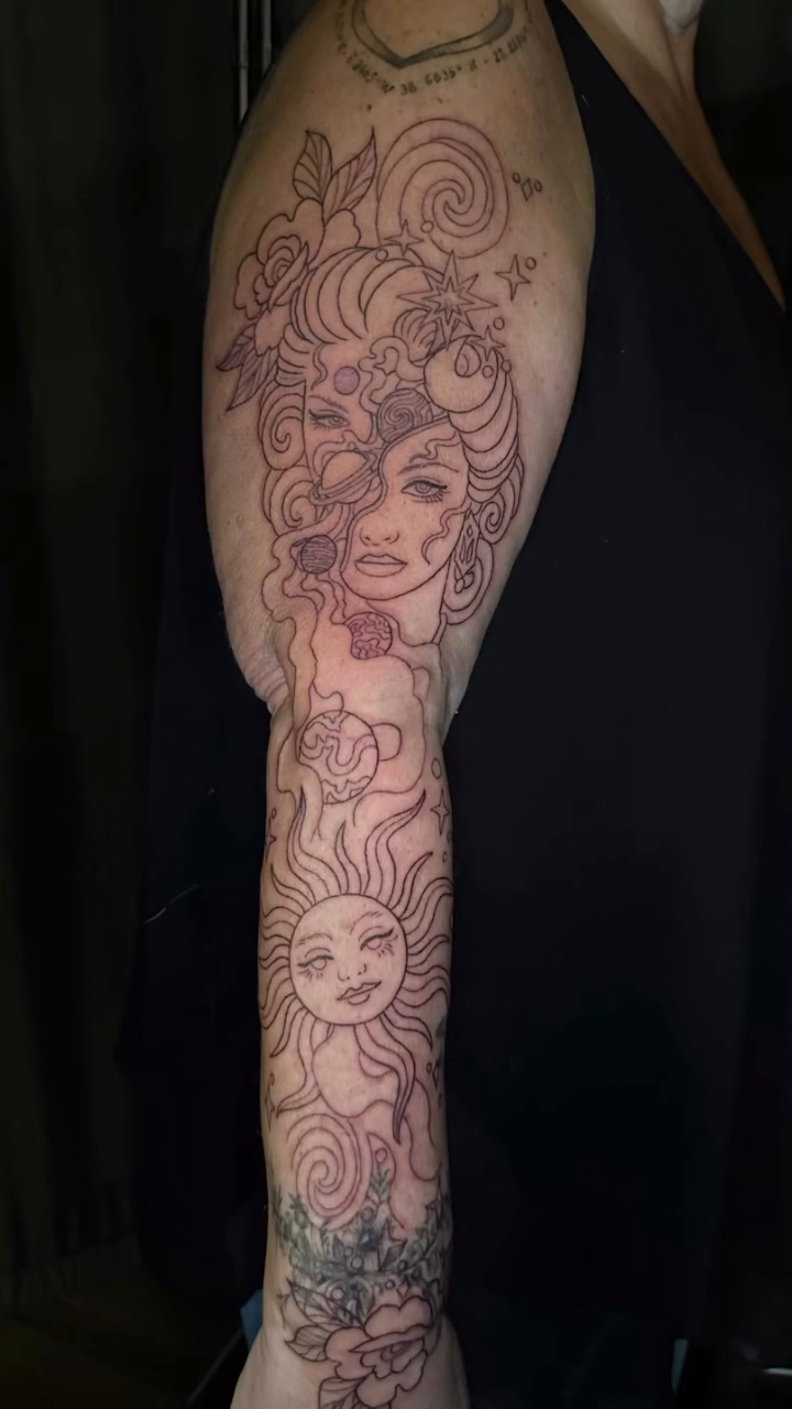 Woman with sun and floral elements neo-traditional tattoo by Lindsey Bendsey