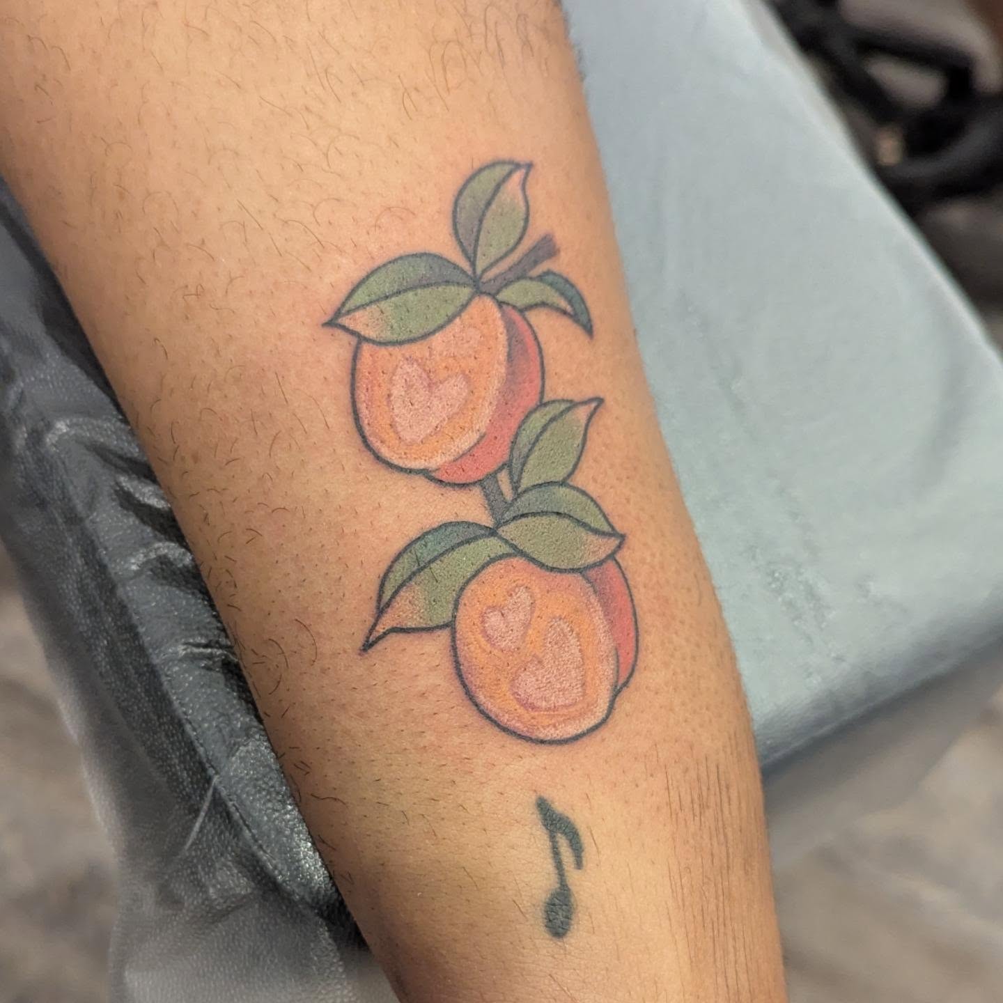 Peaches American traditional tattoo on the forearm by Spencer Jennings, Westland, Michigan