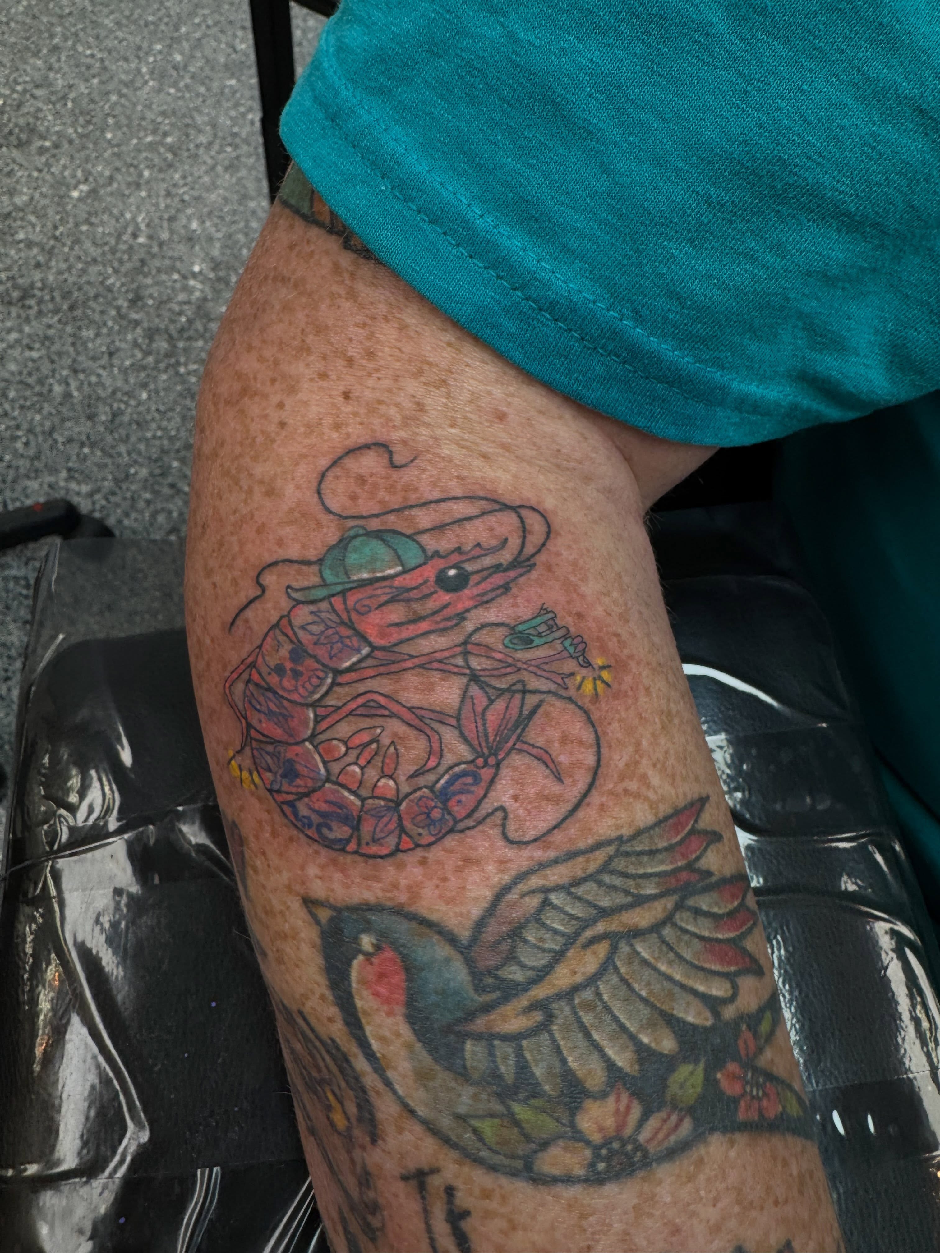Shrimp and bird American traditional tattoo on the thigh by “tatsbysabby”