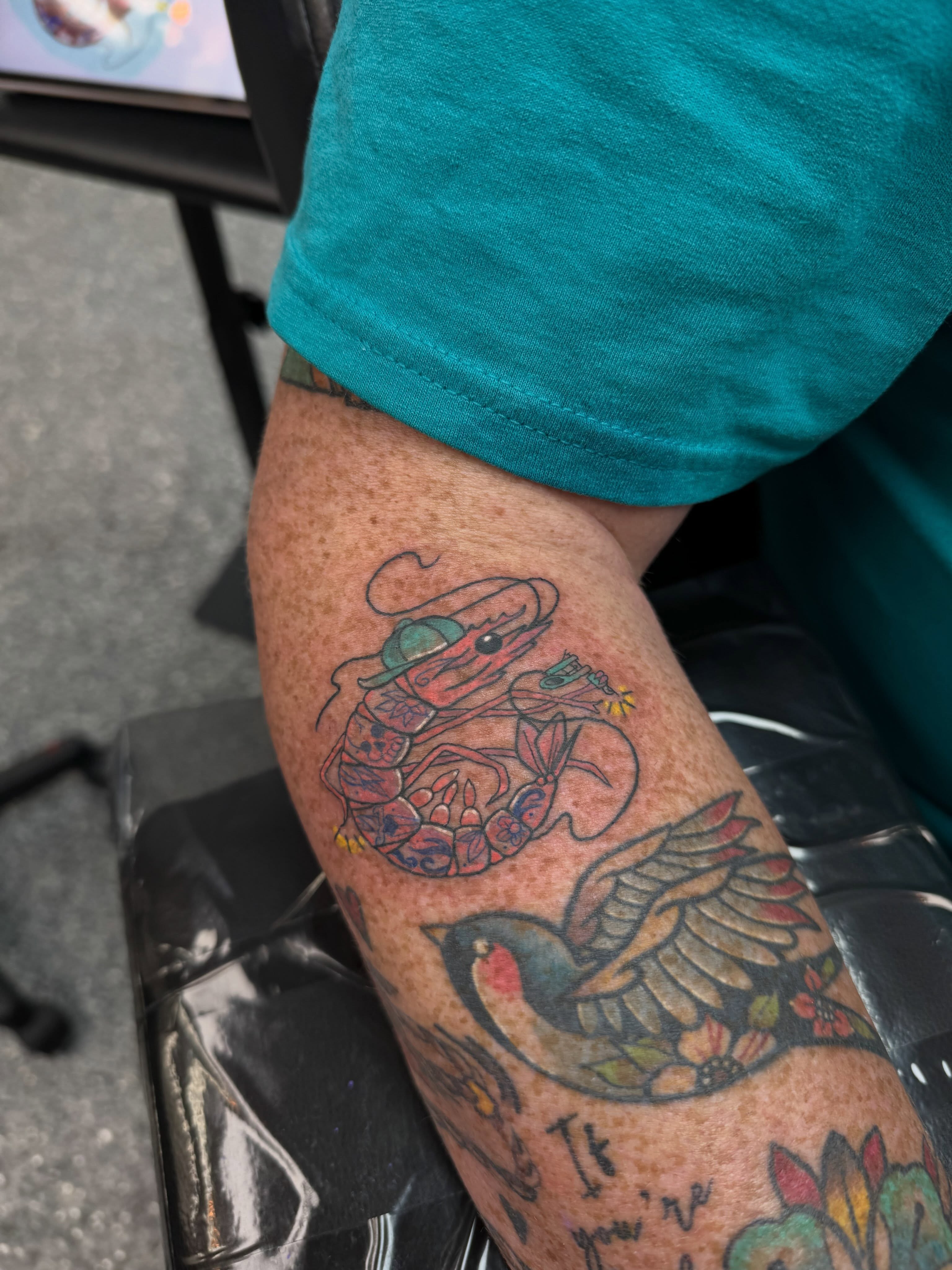 Lobster and hummingbird American traditional tattoo on the forearm by “tatsbysabby”