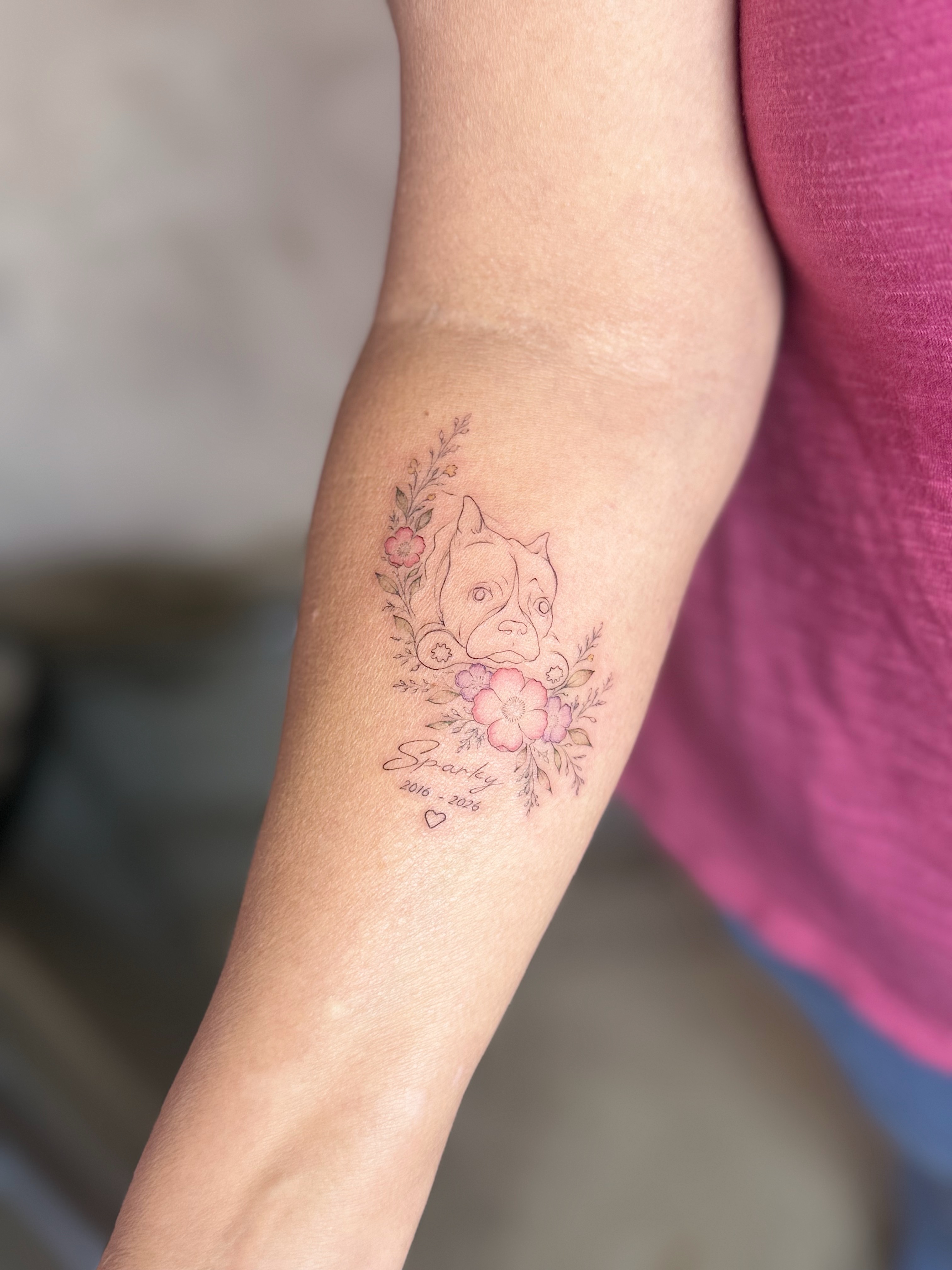 Dog with floral elements realism tattoo on the forearm by INK with Christian, Mineral Wells, Texas