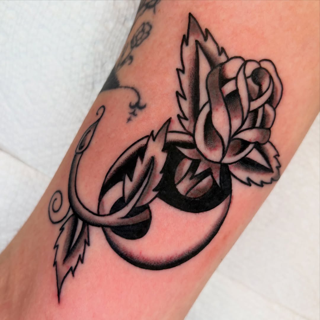 Rose and script ornamental tattoo on the forearm by rachael