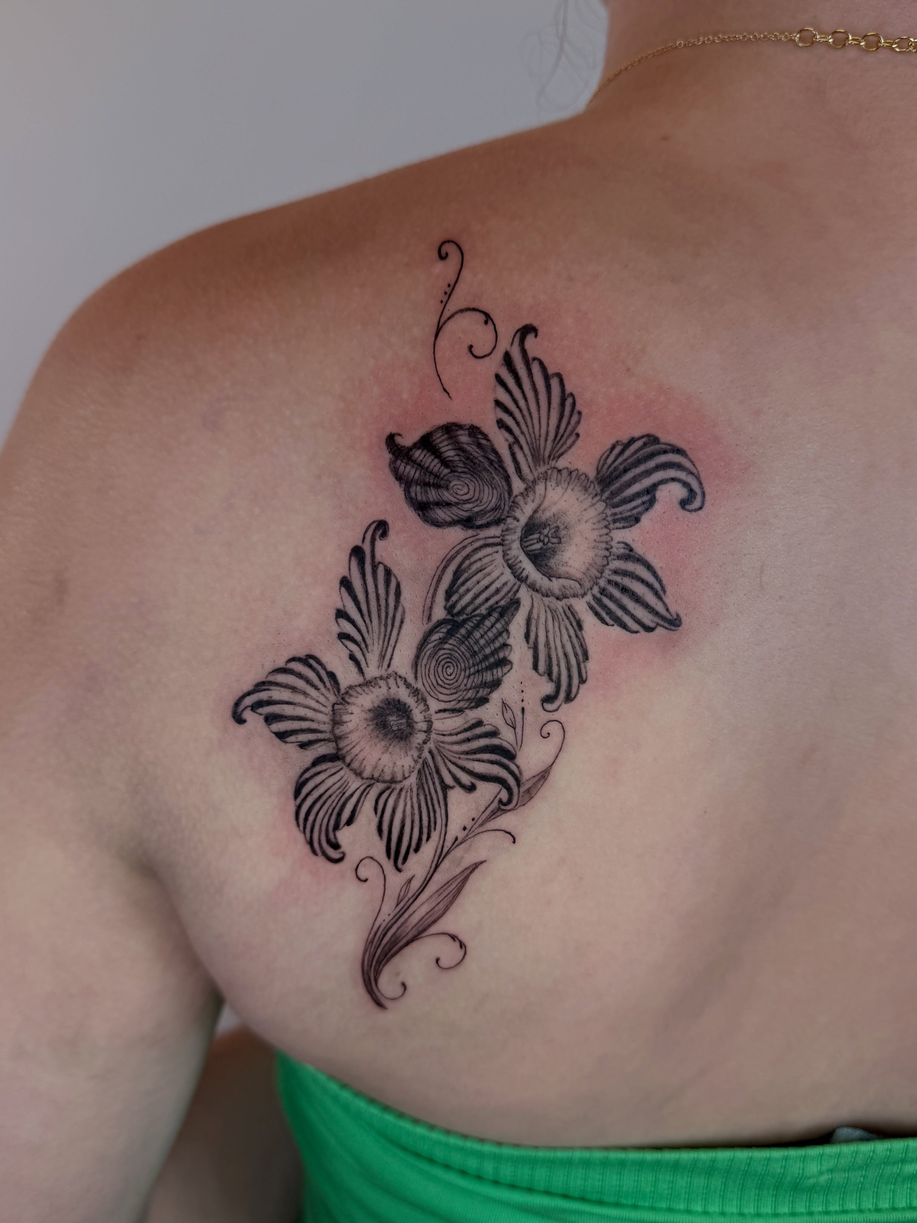 Floral bouquet black and grey tattoo on the shoulder by Yuri Chloe Ngo Tattoo Artist