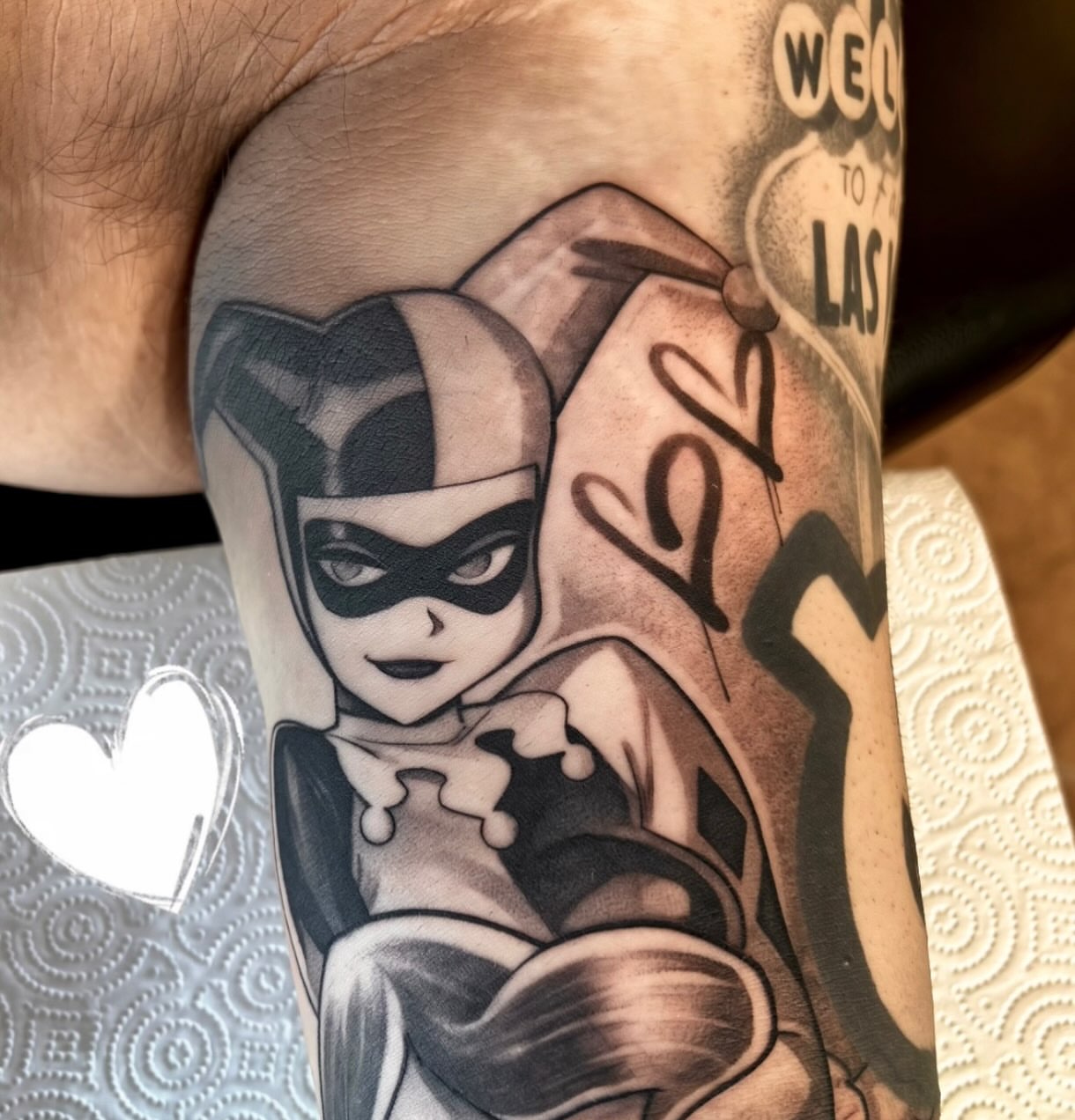 Joker character black and grey tattoo on the forearm by Tattoos by Anthony Davis