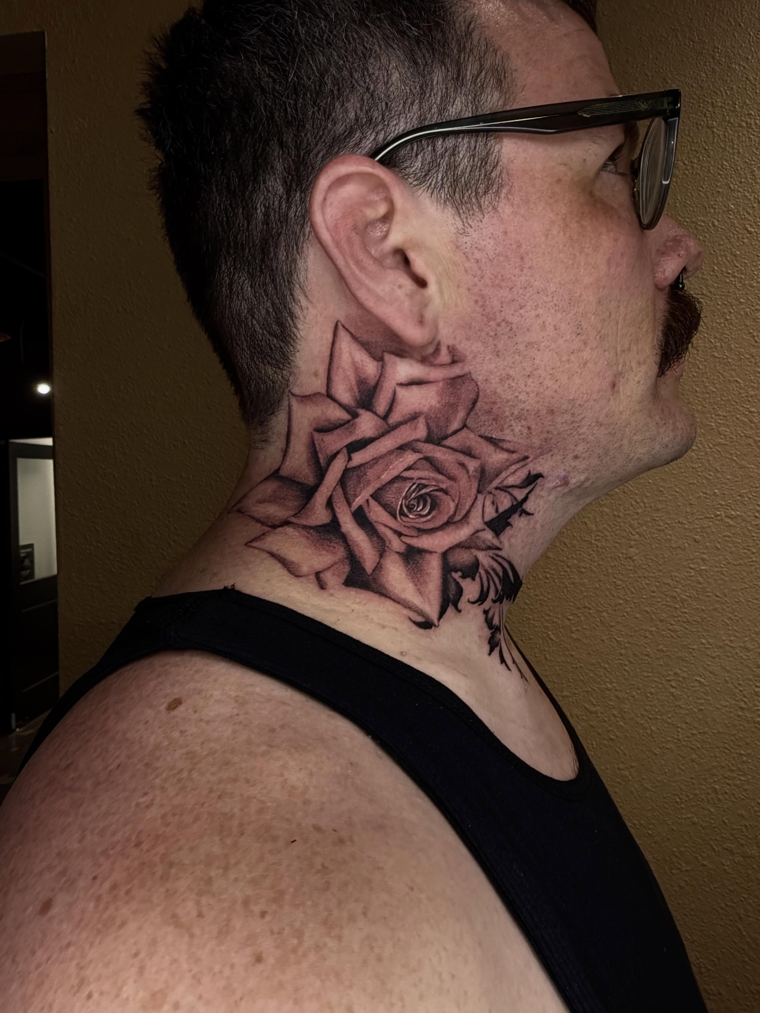 Rose black and grey tattoo on the neck by Emma Mathis, Springfield, Oregon