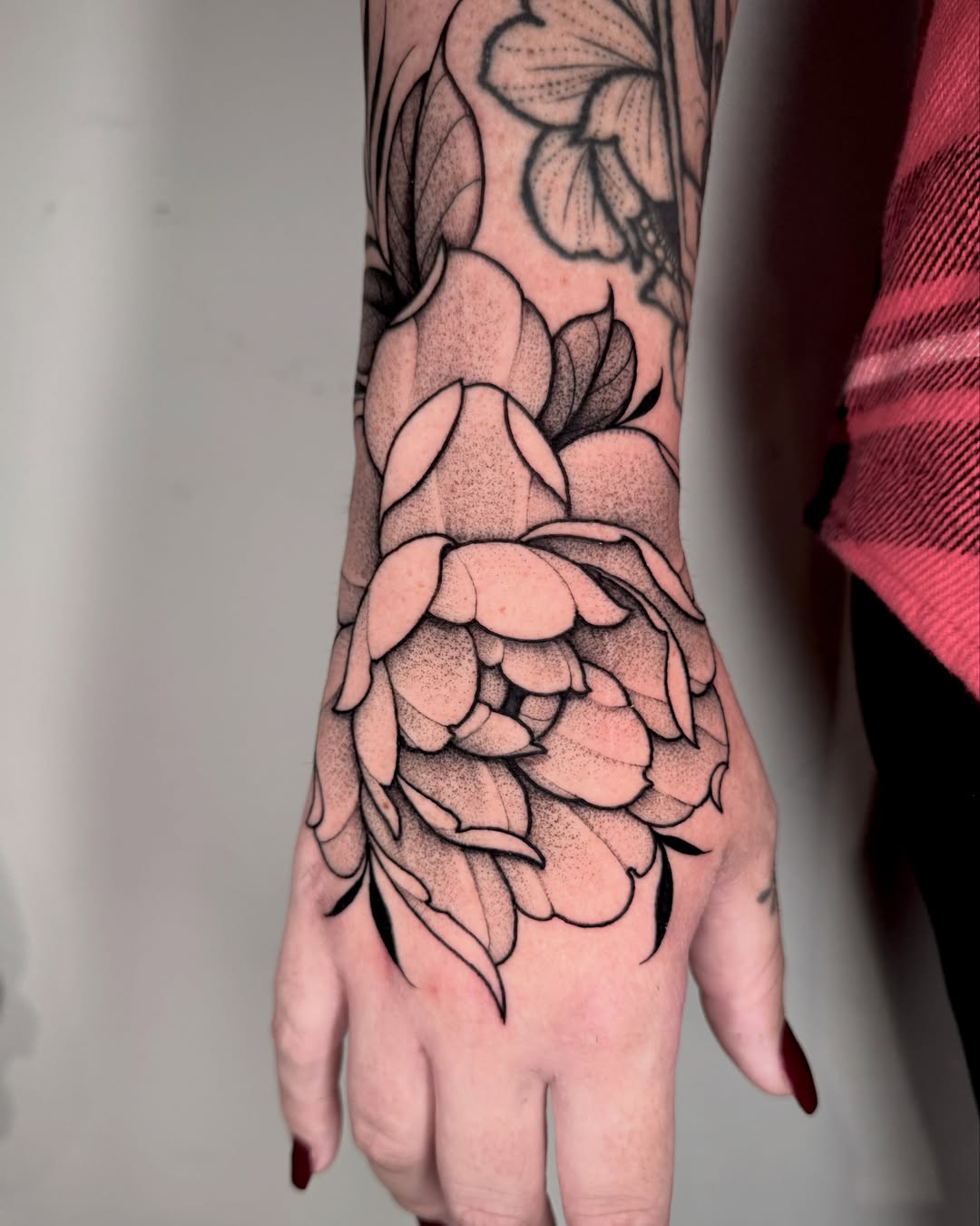 Peony dotwork tattoo on the forearm by Lauren Llerandi