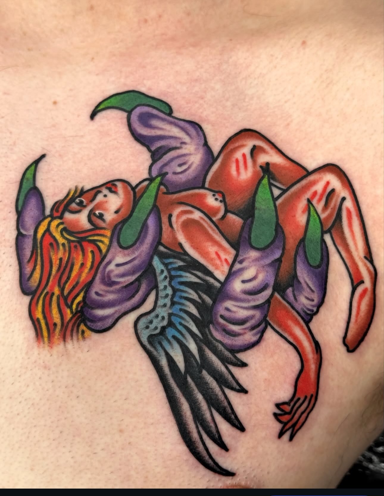 Angel and demon American traditional tattoo on the shoulder by Butch Mickle