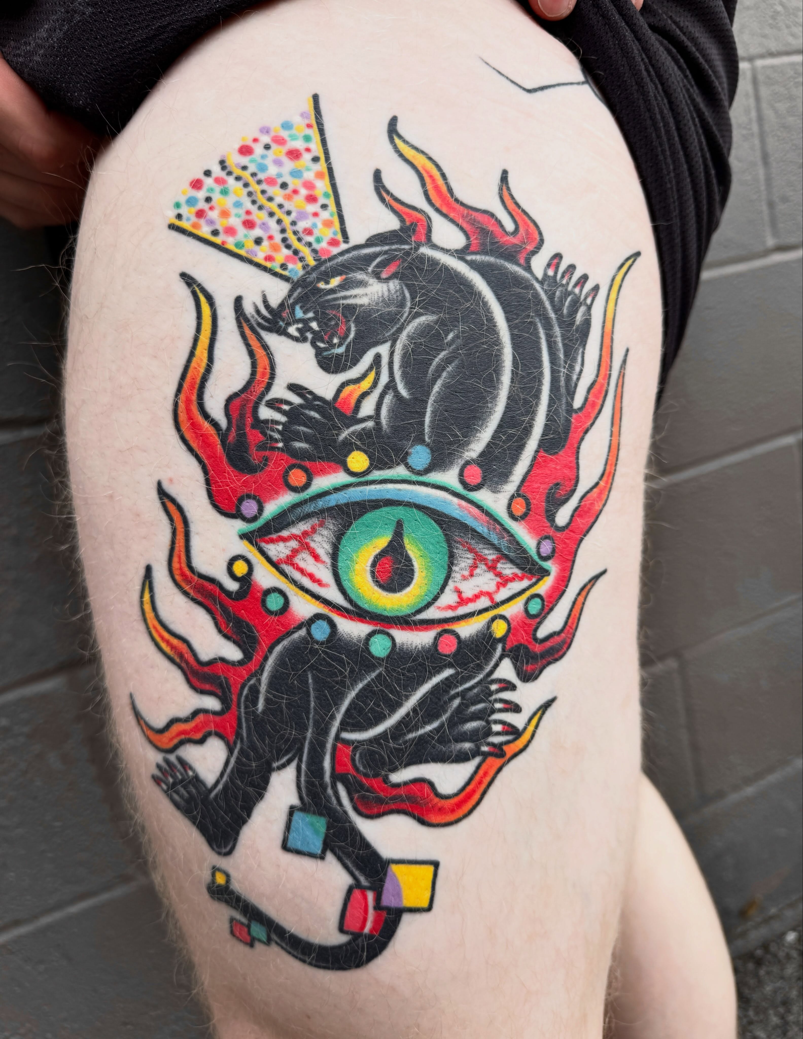 Panther and eye American traditional tattoo on the thigh by Butch Mickle