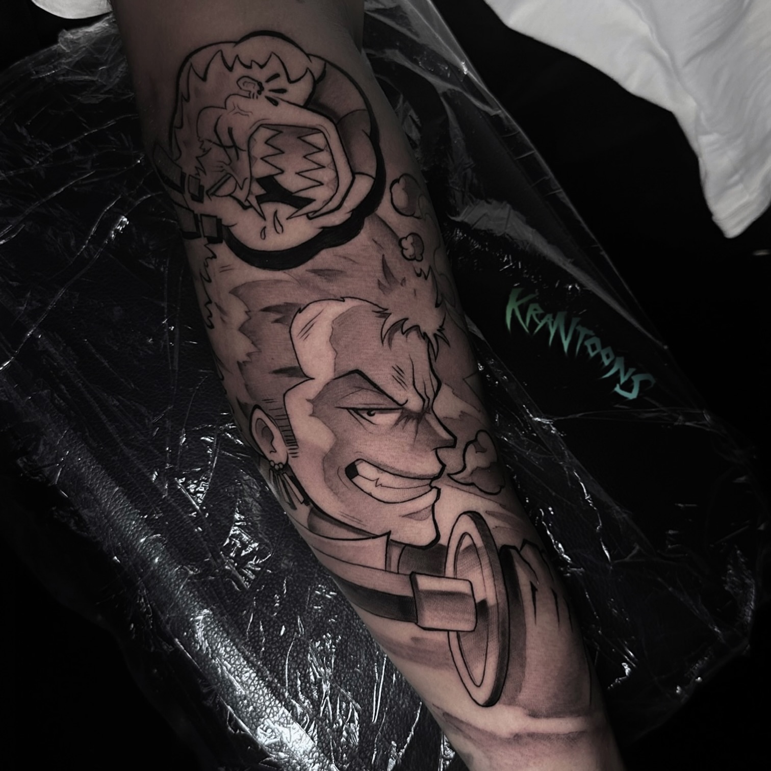 Character black and grey tattoo on the forearm by Jason