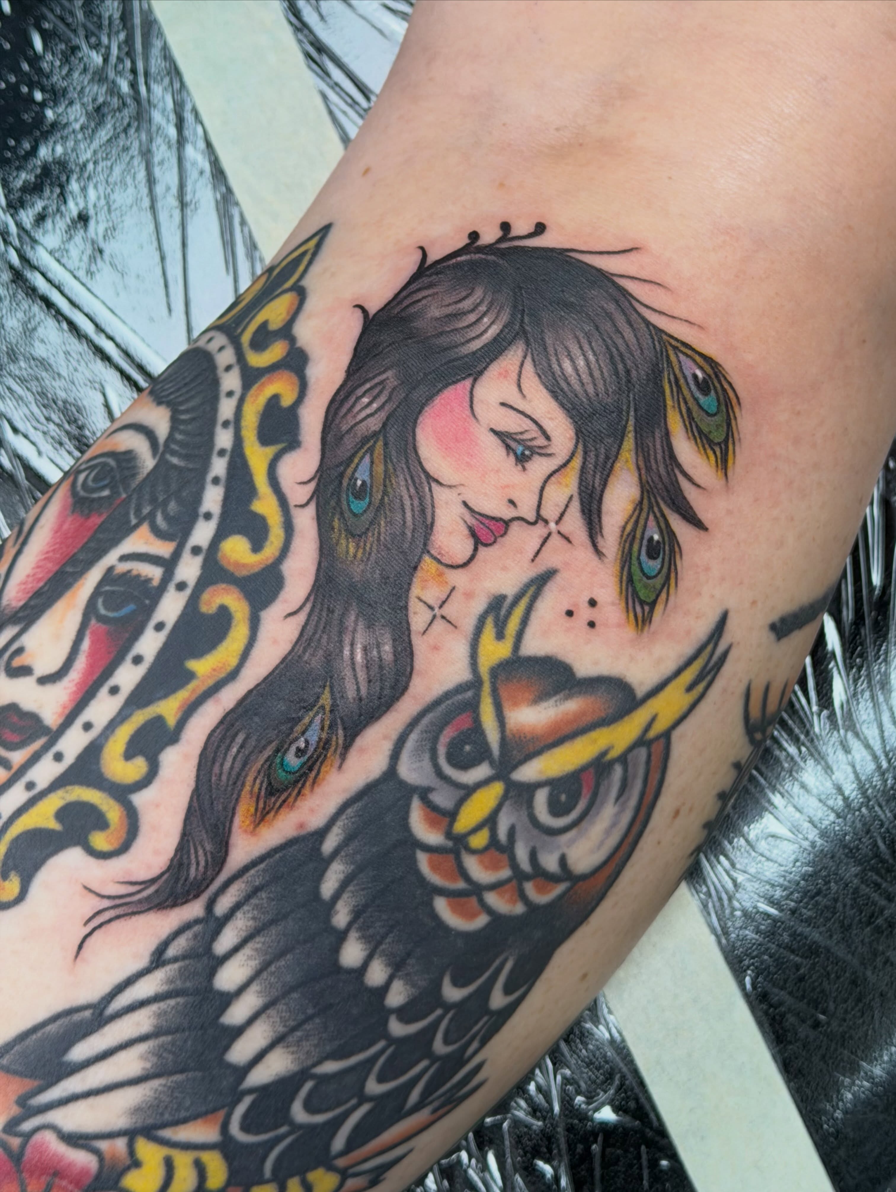 Woman with owl American traditional tattoo on the forearm by Olivia Norbert