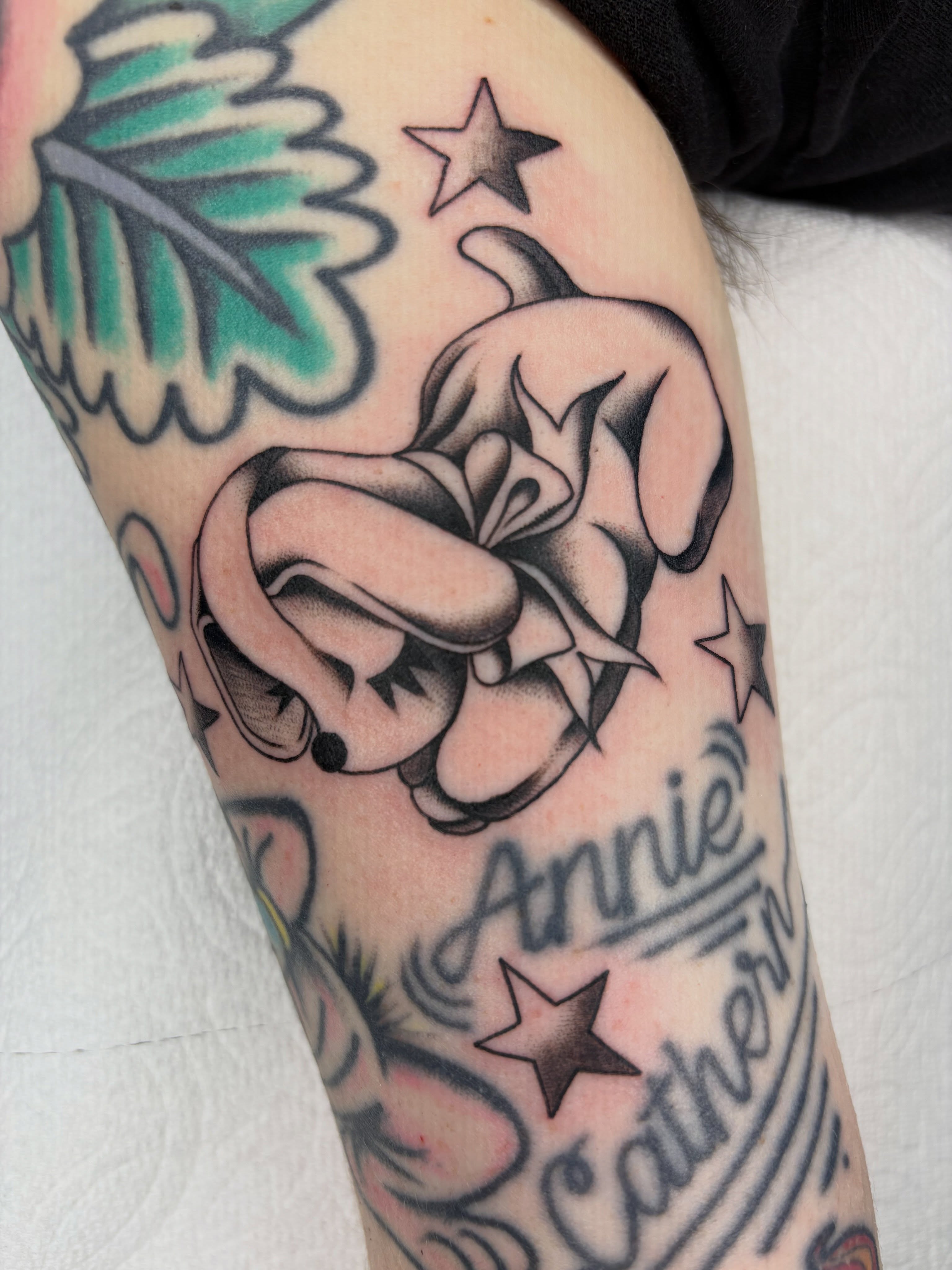 Rose and thorns American traditional tattoo on the forearm by Nori